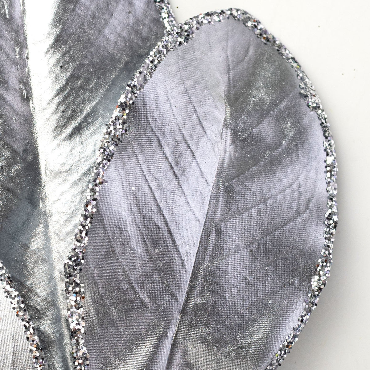 24" Metallic Magnolia Leaves Spray: Silver Lifestyle Photo