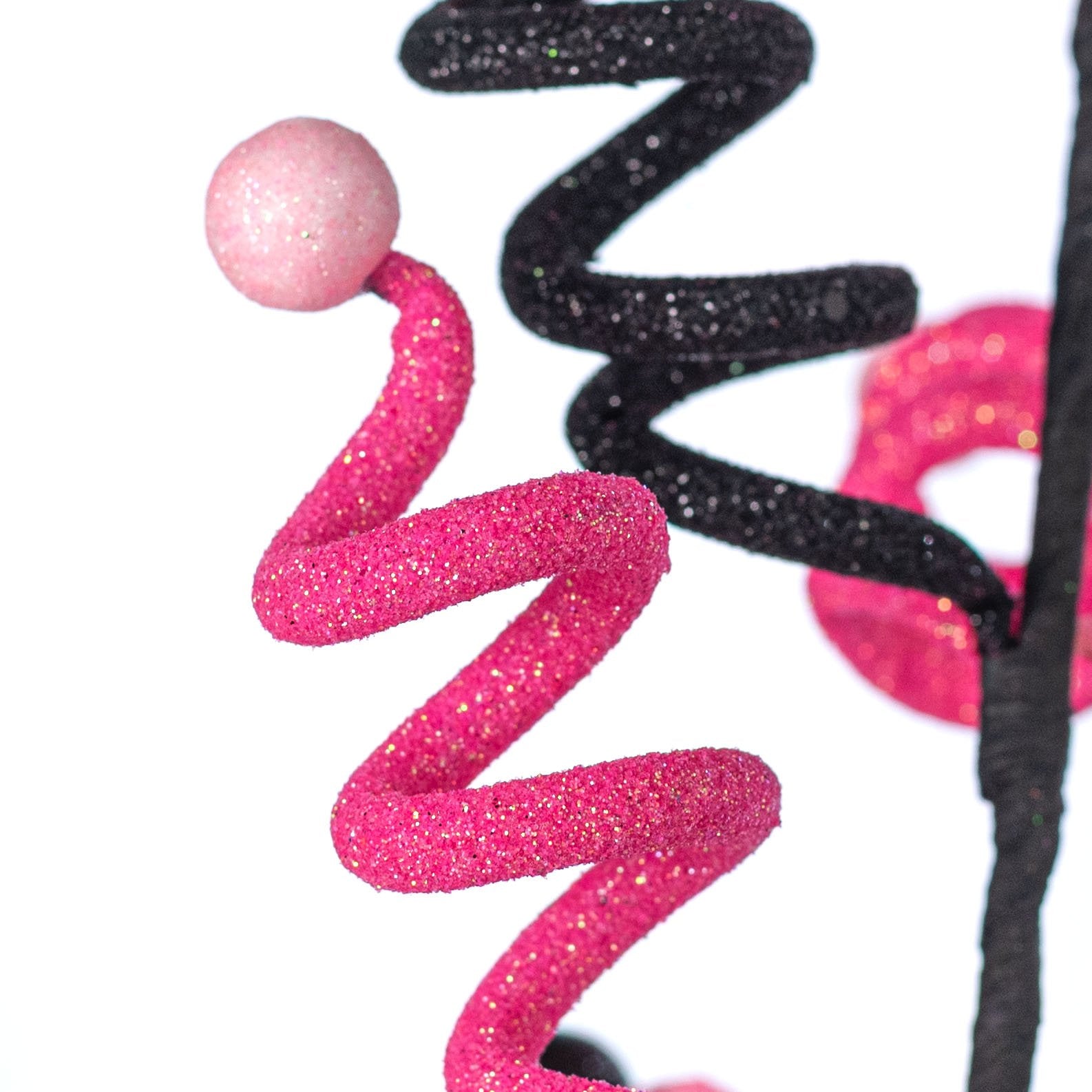 26:" Curly Ball Spray: Pink & Black Lifestyle Photo