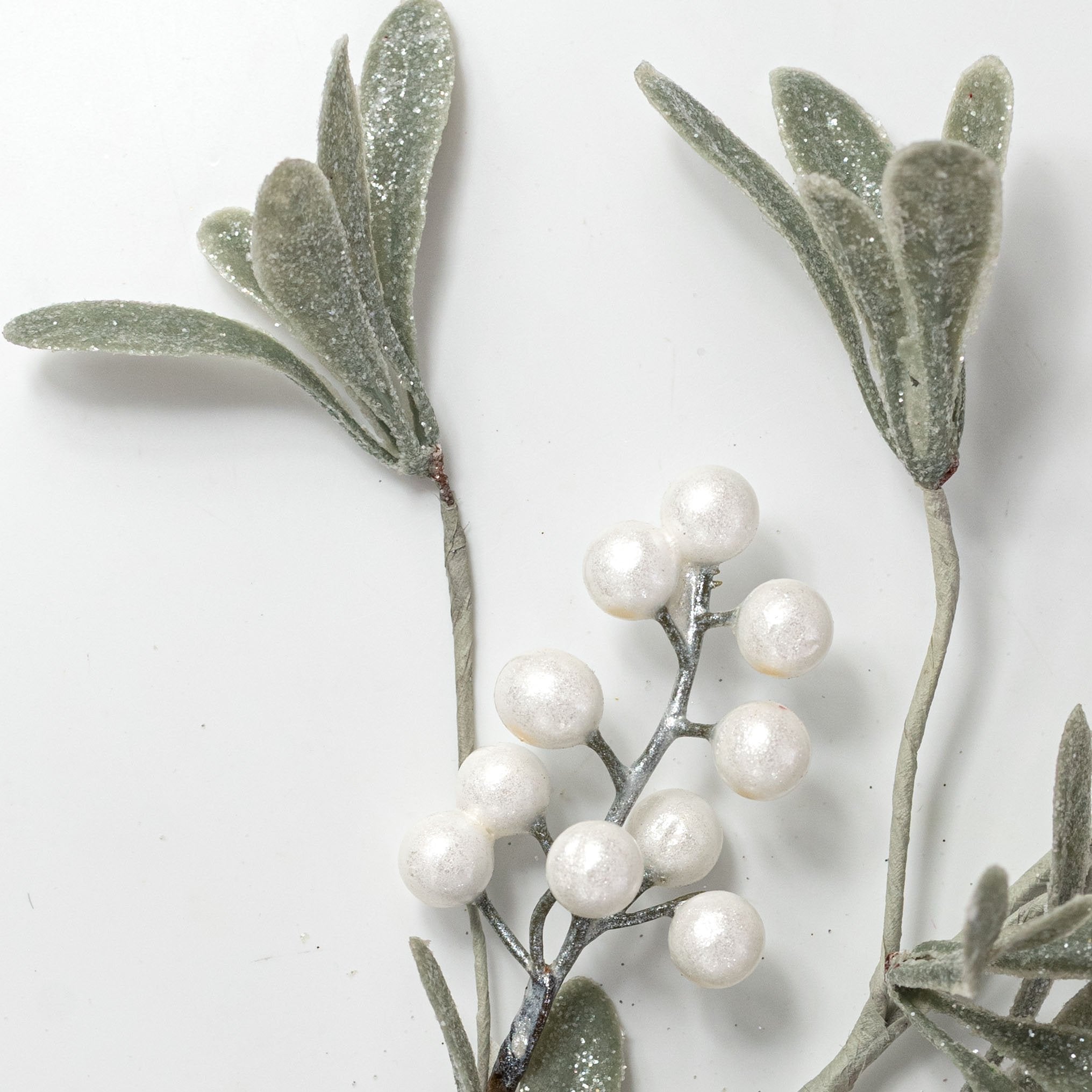 26" Glittered Mistletoe Leaf & Berry Spray: Green & Pearl White Lifestyle Photo