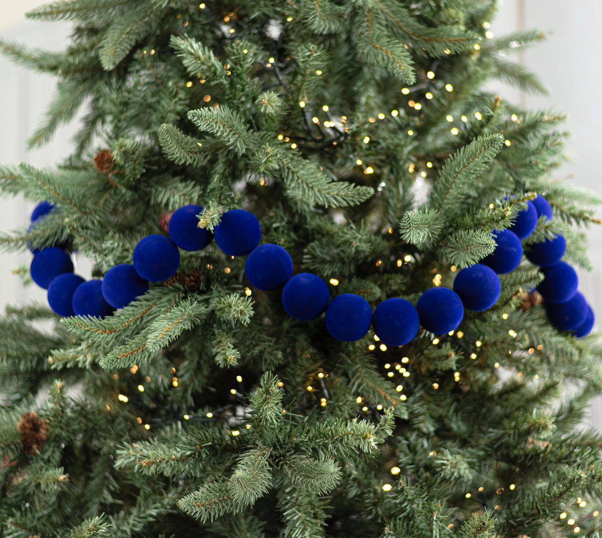 72" Flocked Ball Garland: 50mm Navy Blue (36 Balls) Lifestyle Photo