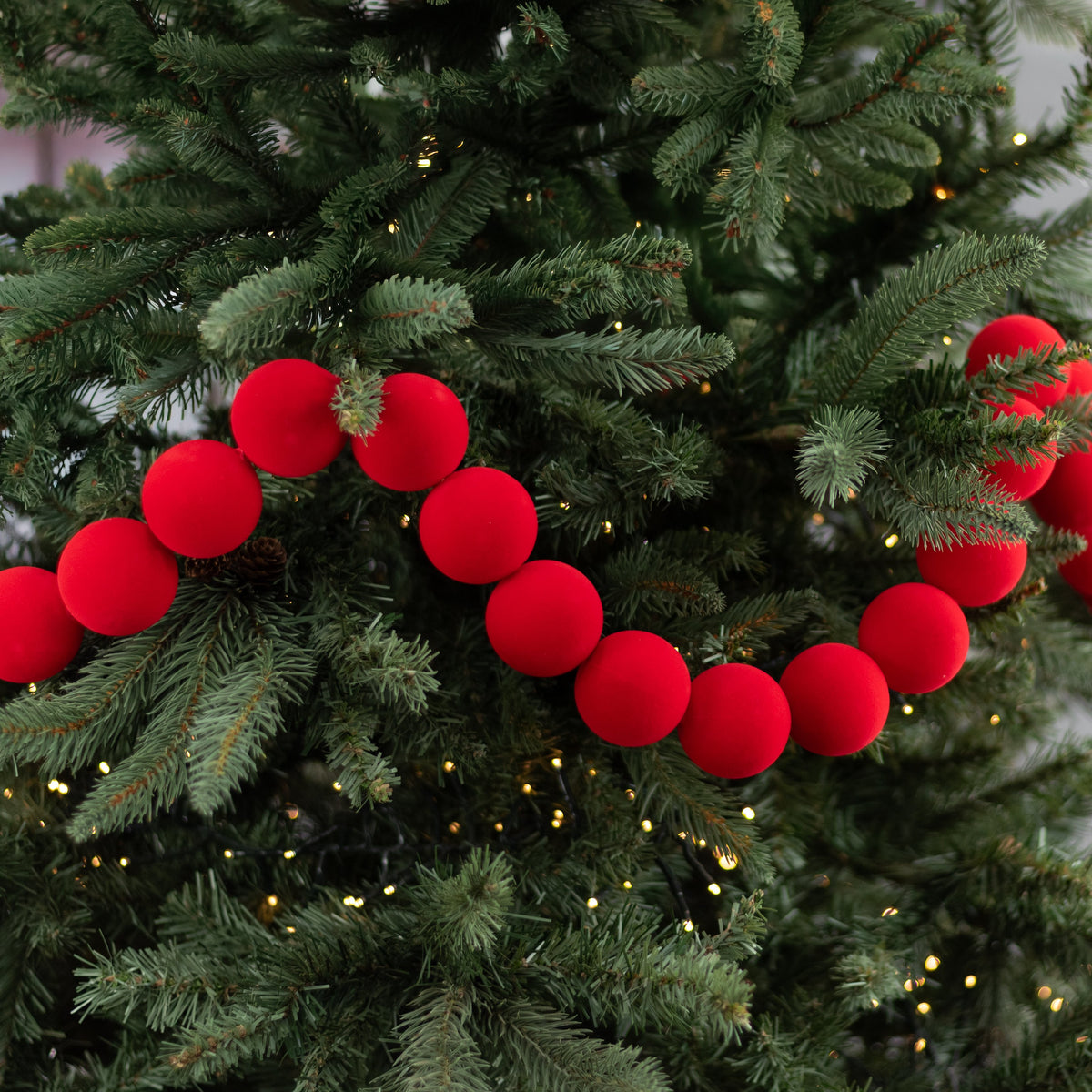 72" Flocked Ball Garland: 50mm Red (36 Balls) Lifestyle Photo
