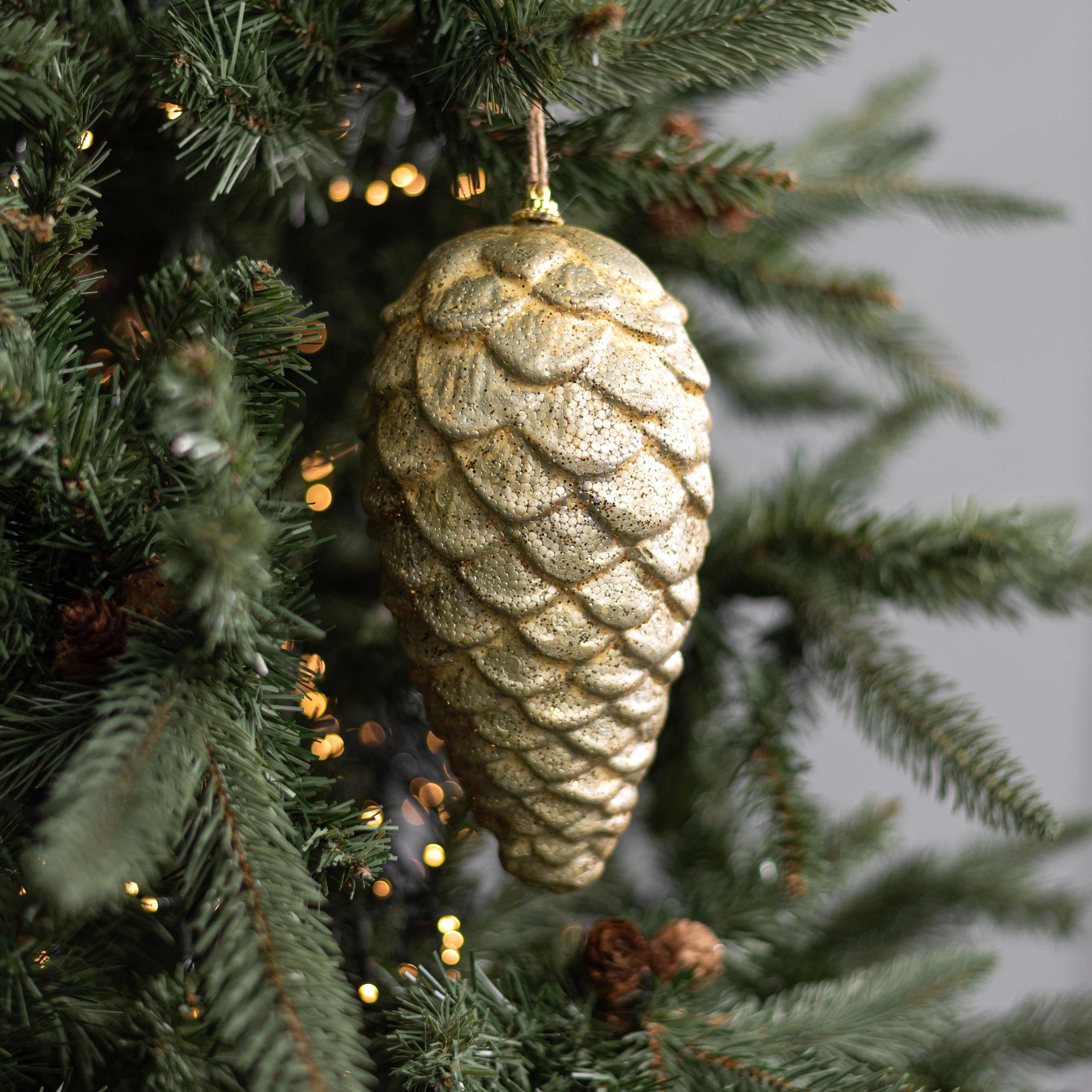 8.5" Rustic Pinecone Ornament: Antique Gold Lifestyle Photo