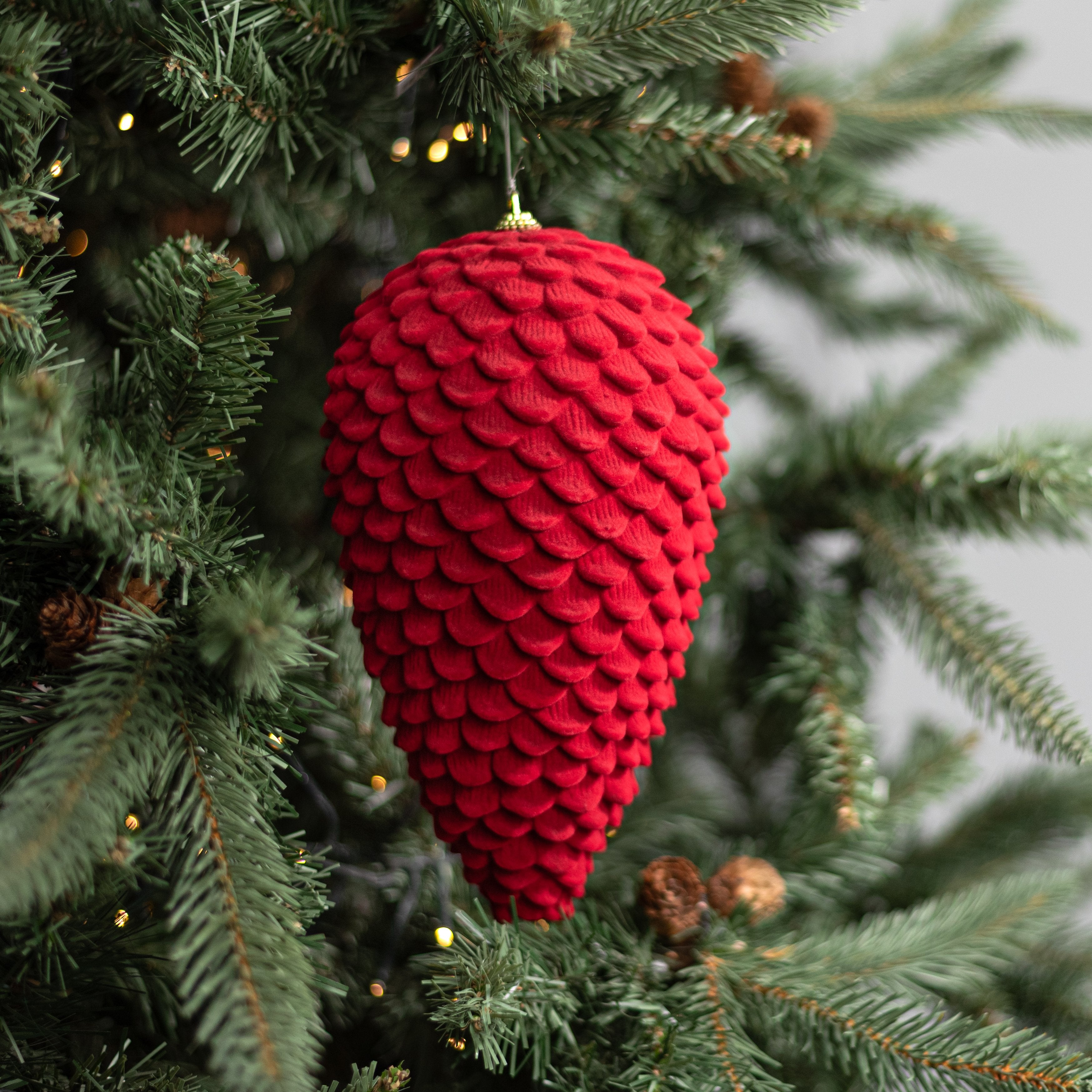 9.5" Flocked Pinecone Ornament: Red Lifestyle Photo