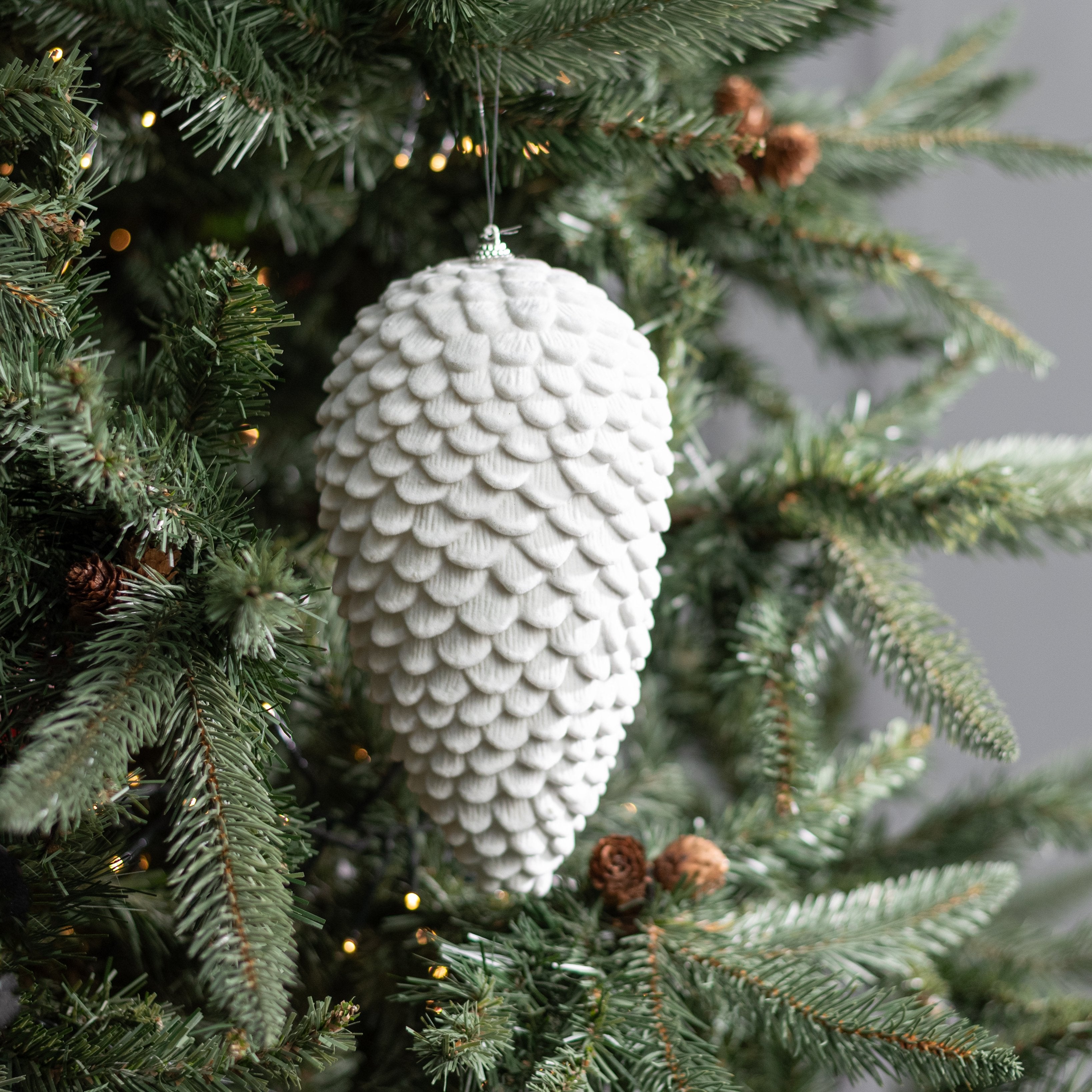9.5" Flocked Pinecone Ornament: White Lifestyle Photo