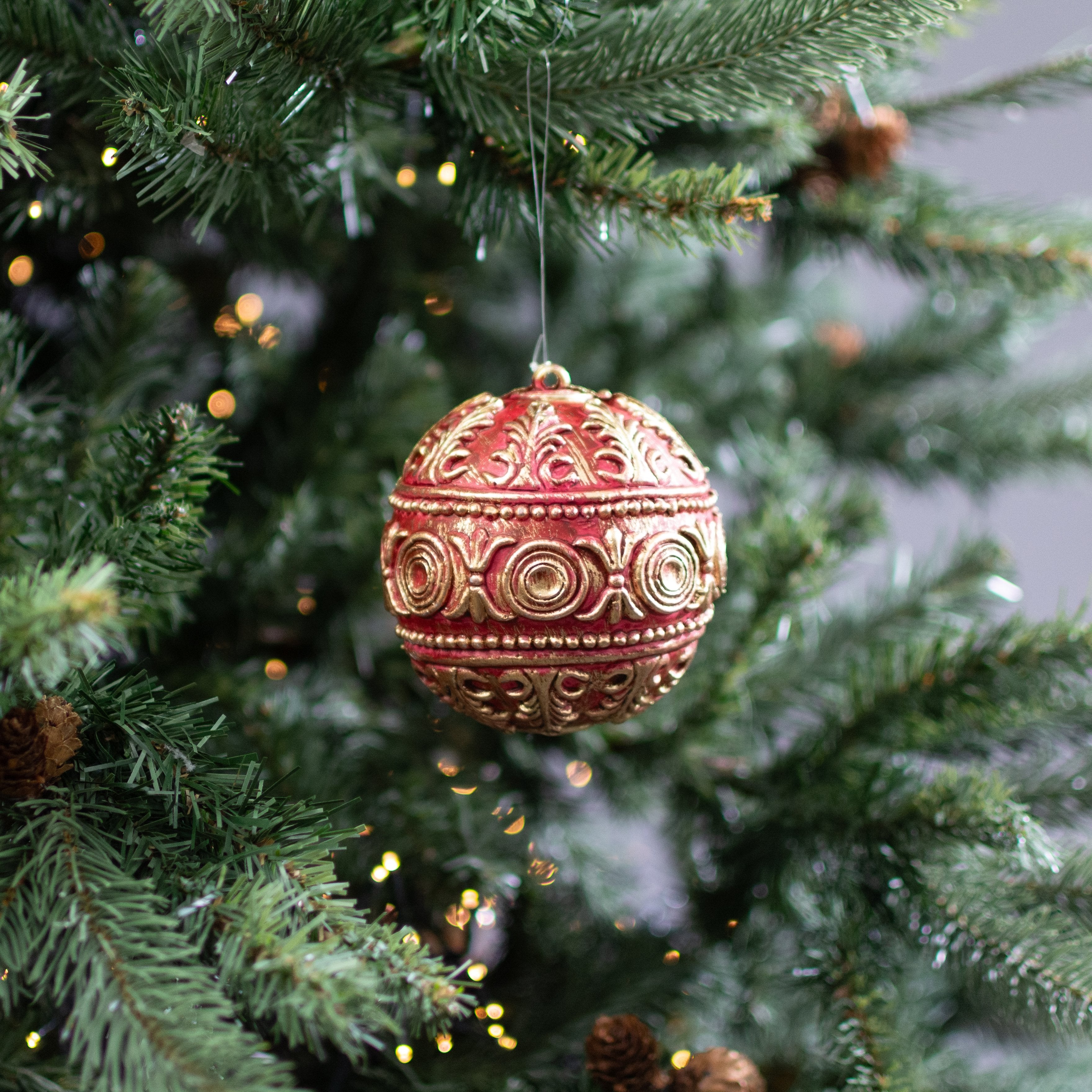 4" Antiqued Plastic Ball Ornament: Dark Red & Gold Lifestyle Photo