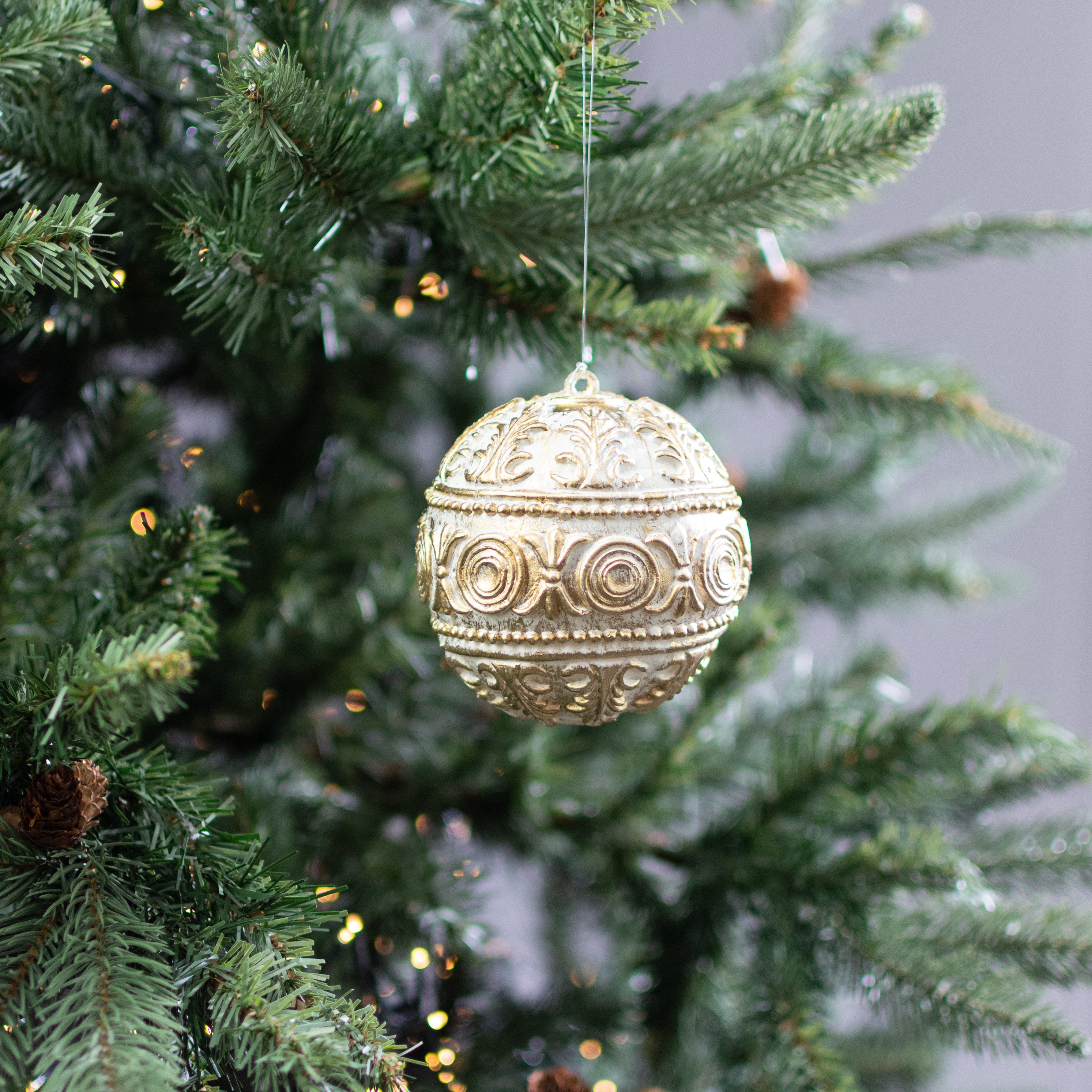 4" Antiqued Plastic Ball Ornament: Gold & White Lifestyle Photo