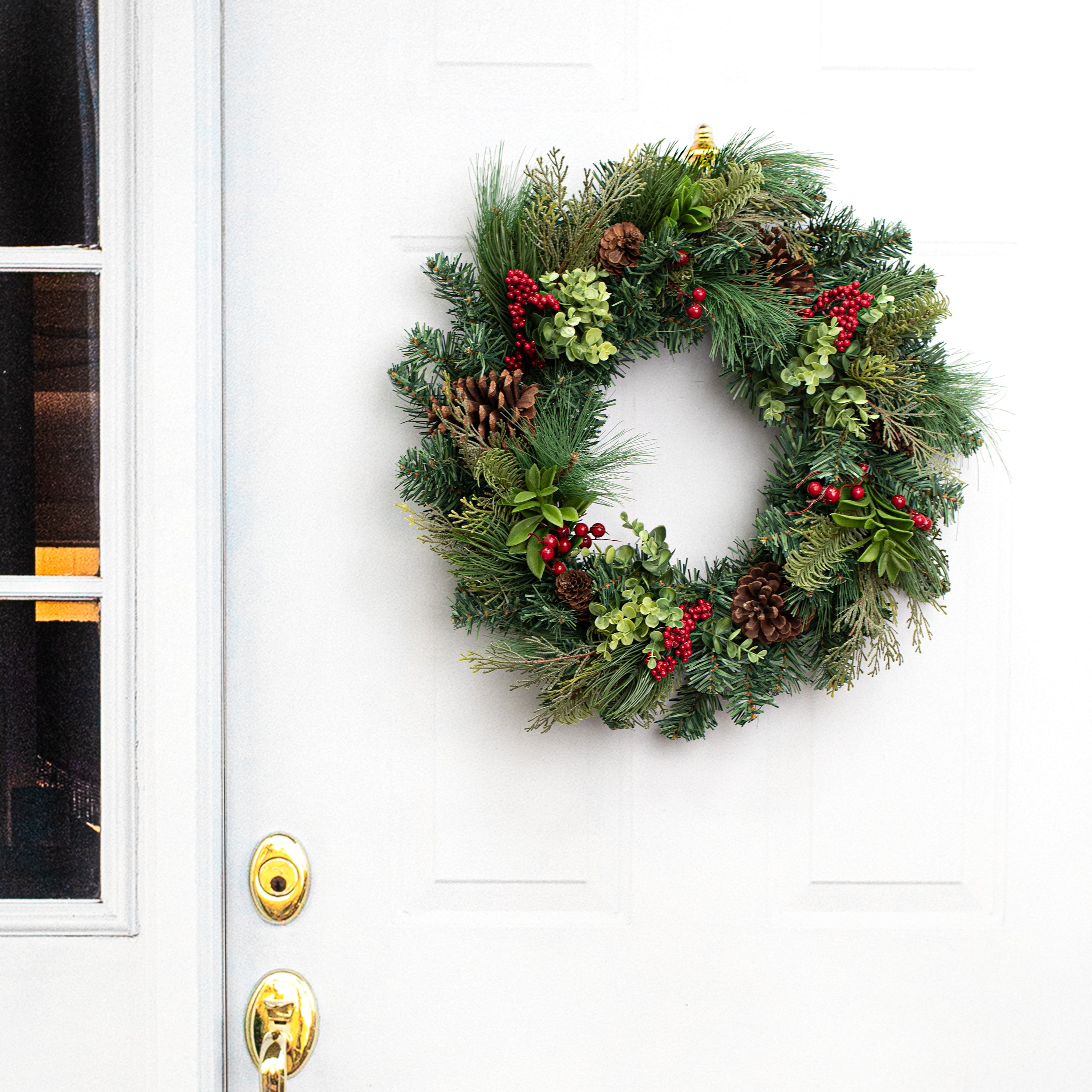 24" Berry & Pinecone Pine Wreath Lifestyle Photo