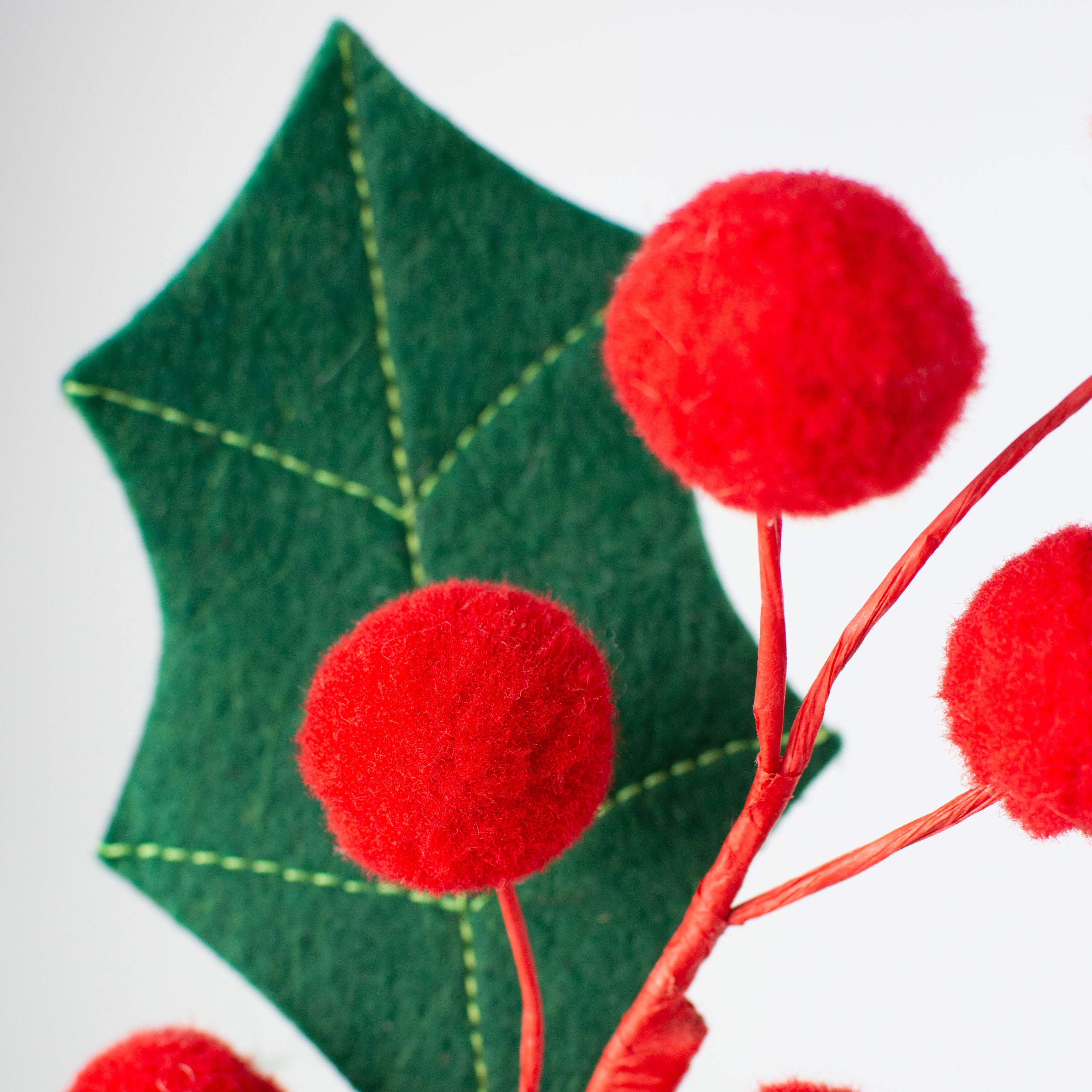 20" Berry Pom Pom & Felt Leaf Holly Spray Lifestyle Photo