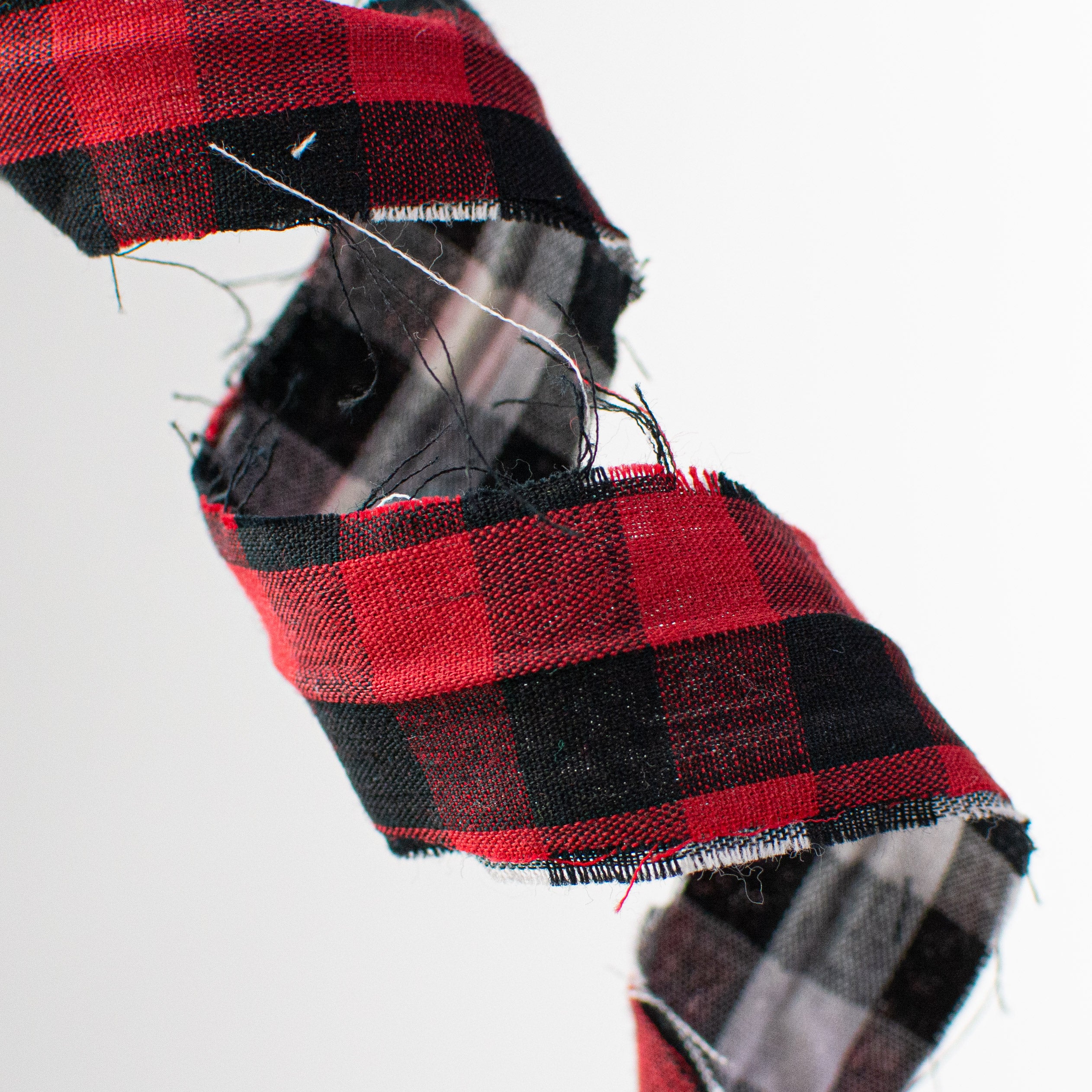 30" Double Sided Check Plaid Frizzy Curly Spray: Red, Black, White Lifestyle Photo