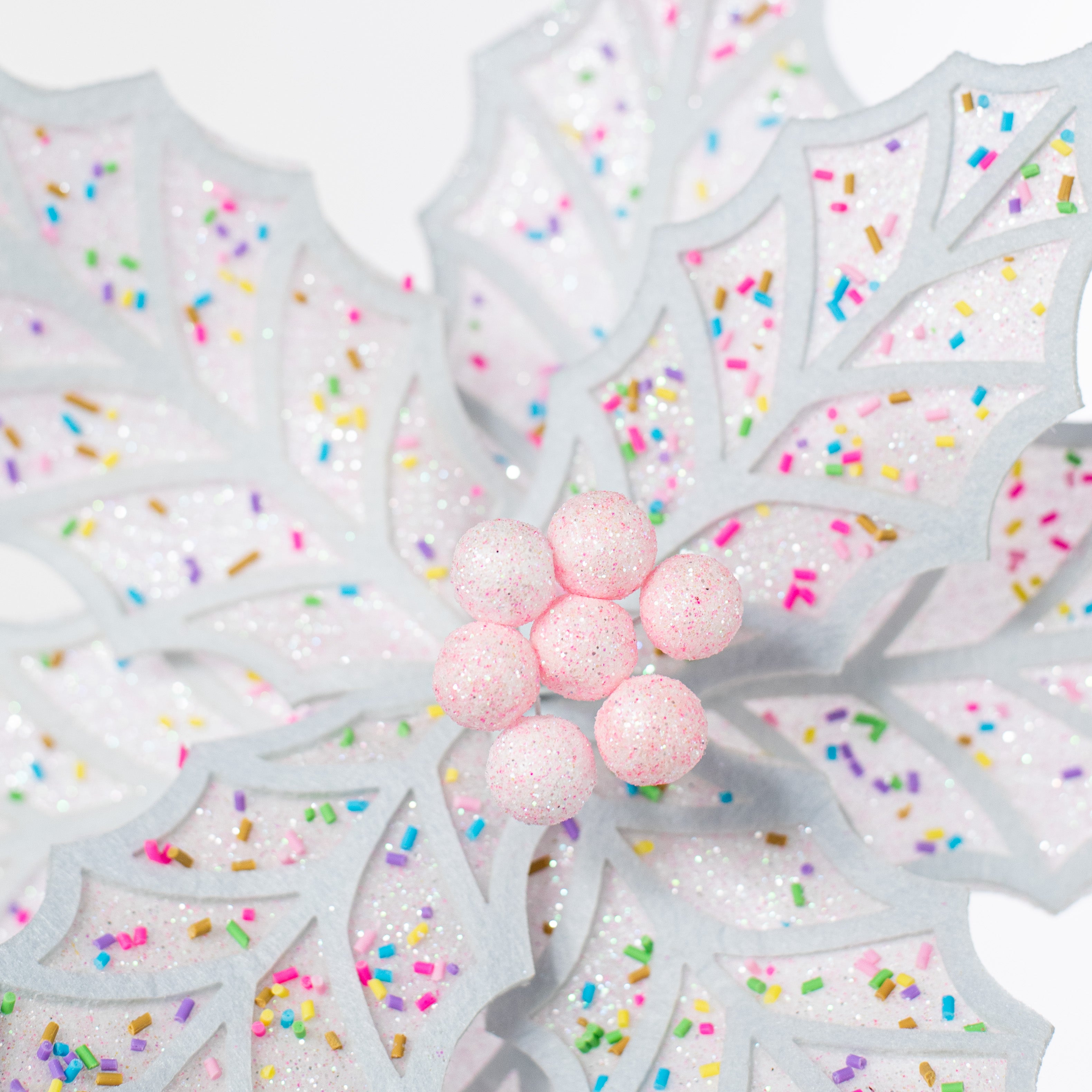 22" Confetti Poinsettia Stem: Pink & White Lifestyle Photo