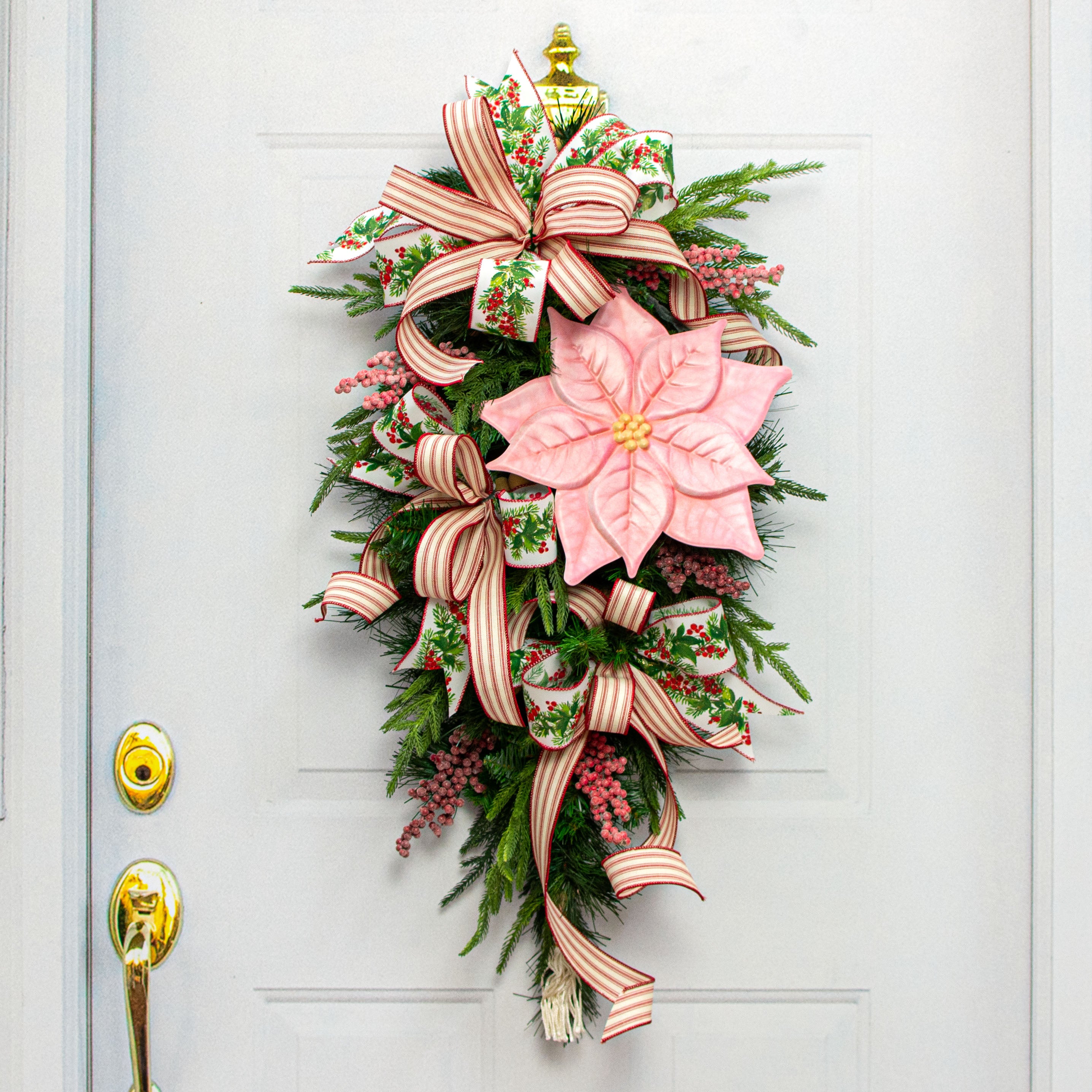 12" Embossed Metal Hanger: Pink Poinsettia Lifestyle Photo