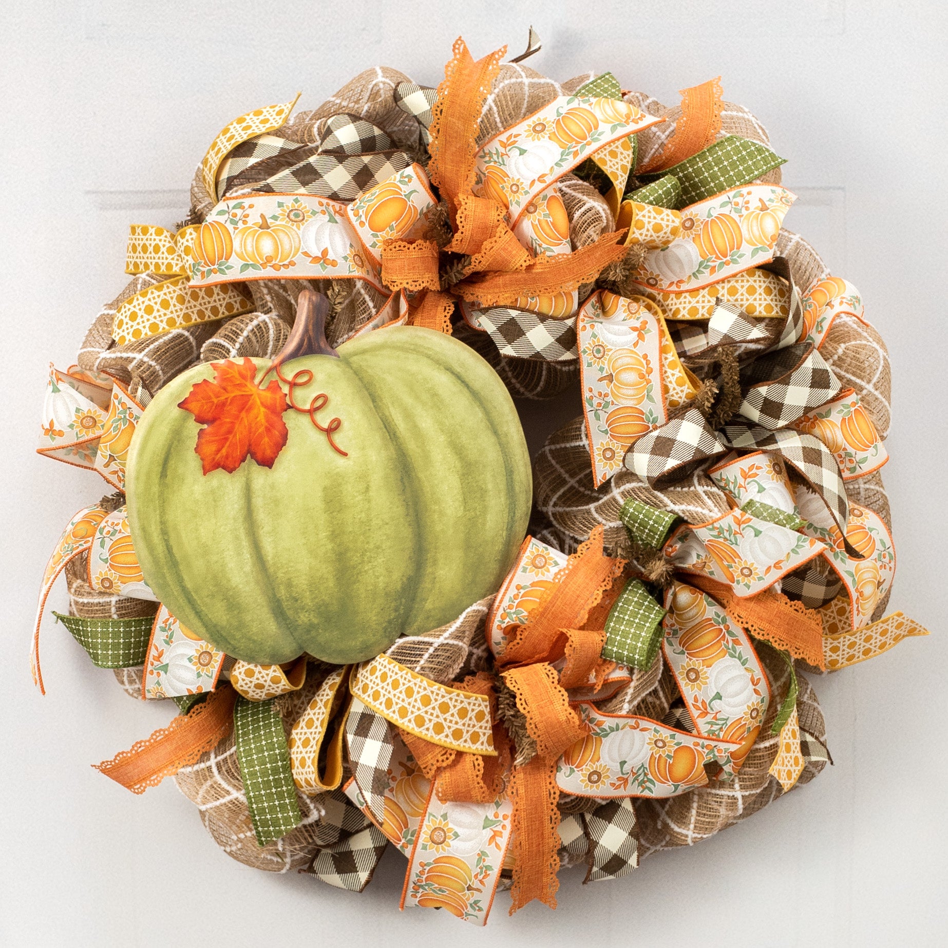 12" Embossed Metal Pumpkin Hanger: Moss Lifestyle Photo