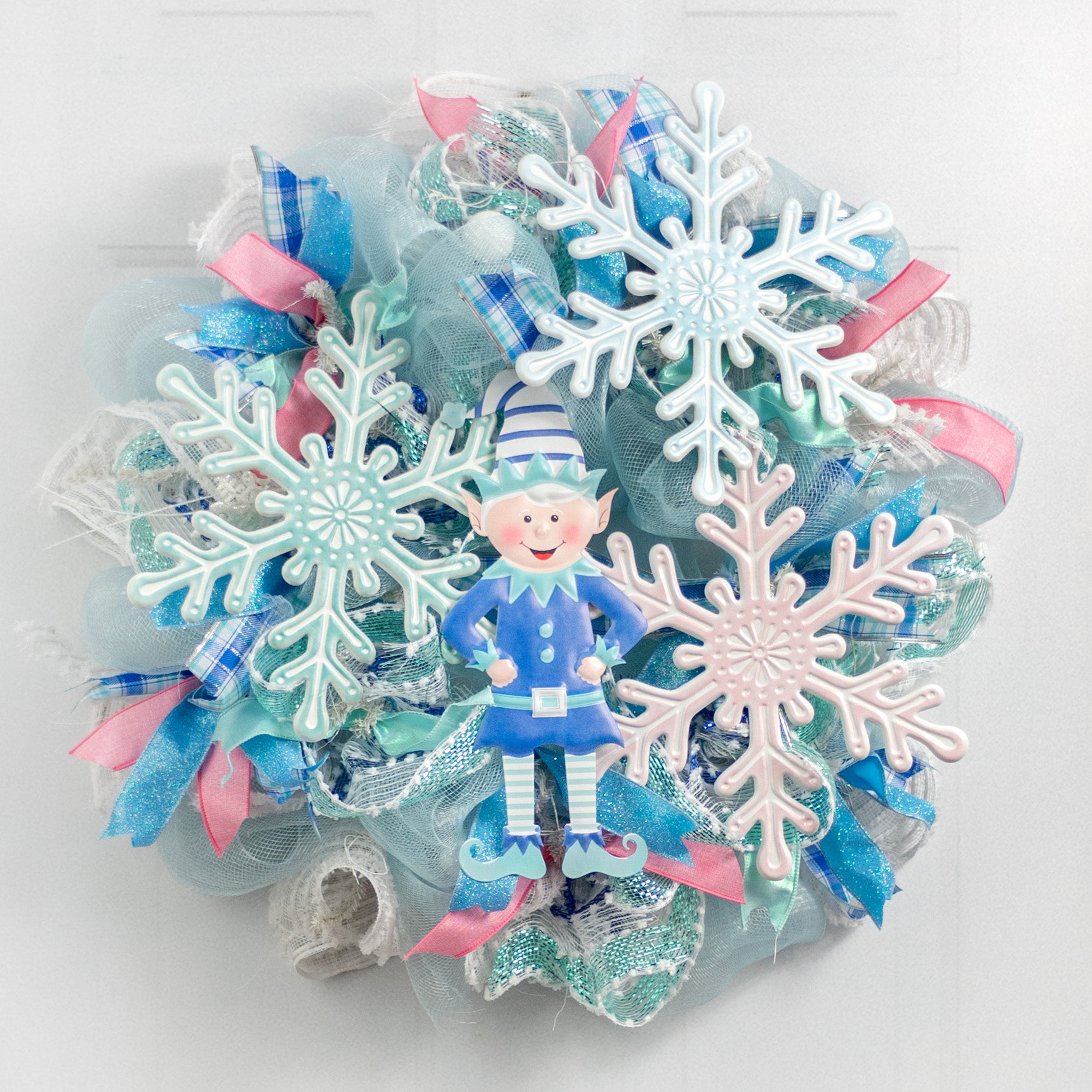 12" Embossed Metal Snowflake Hanger: Pale Blue & White Lifestyle Photo