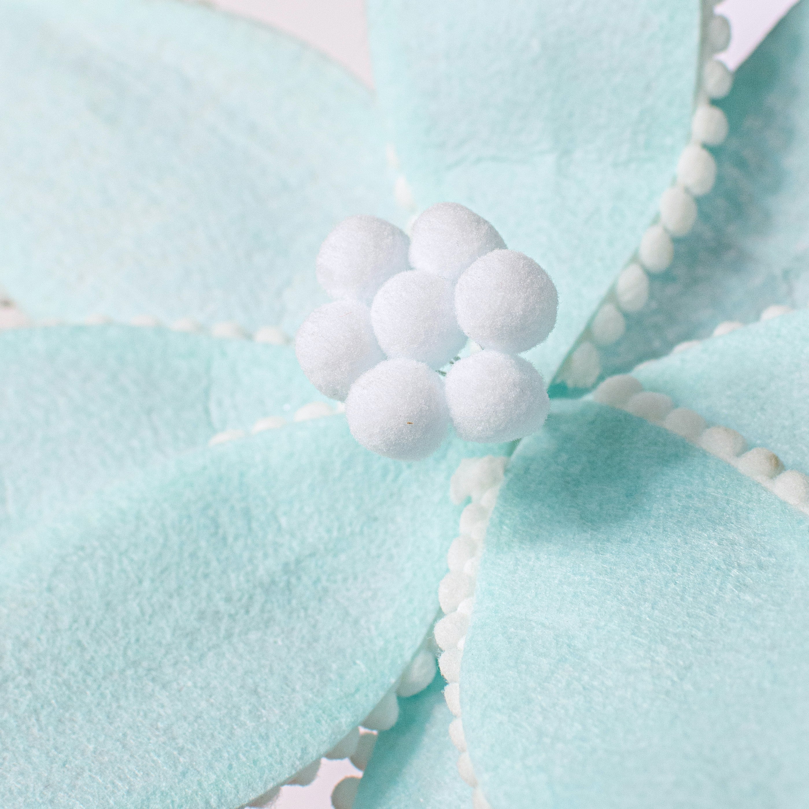 12" Felt Poinsettia Ball Fringe Stem: Light Blue Lifestyle Photo