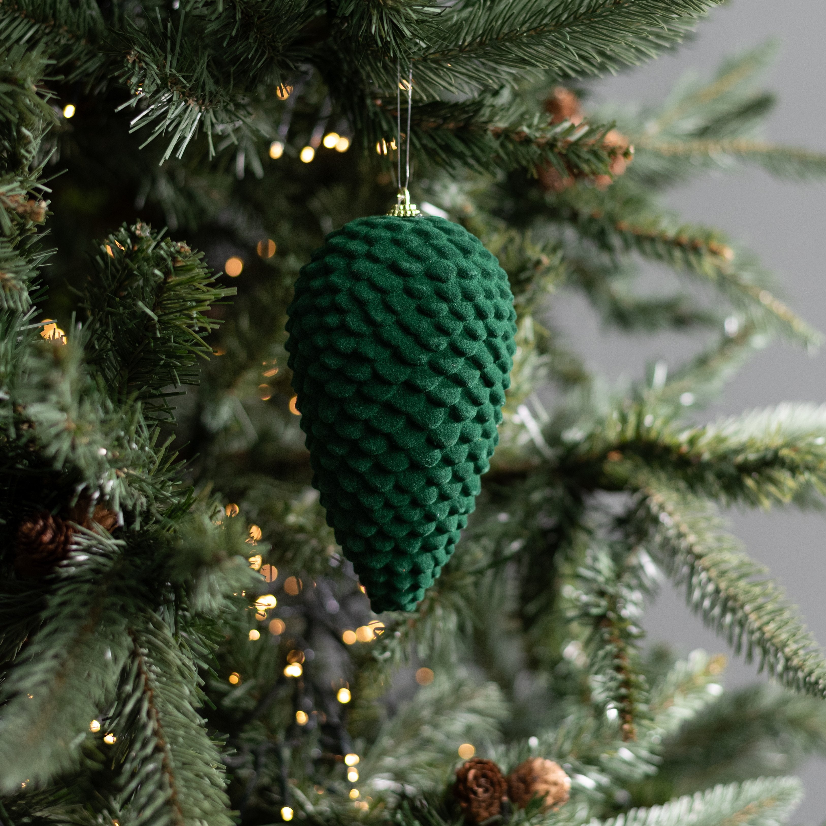 6" Flocked Pinecone Ornament: Dark Green Lifestyle Photo