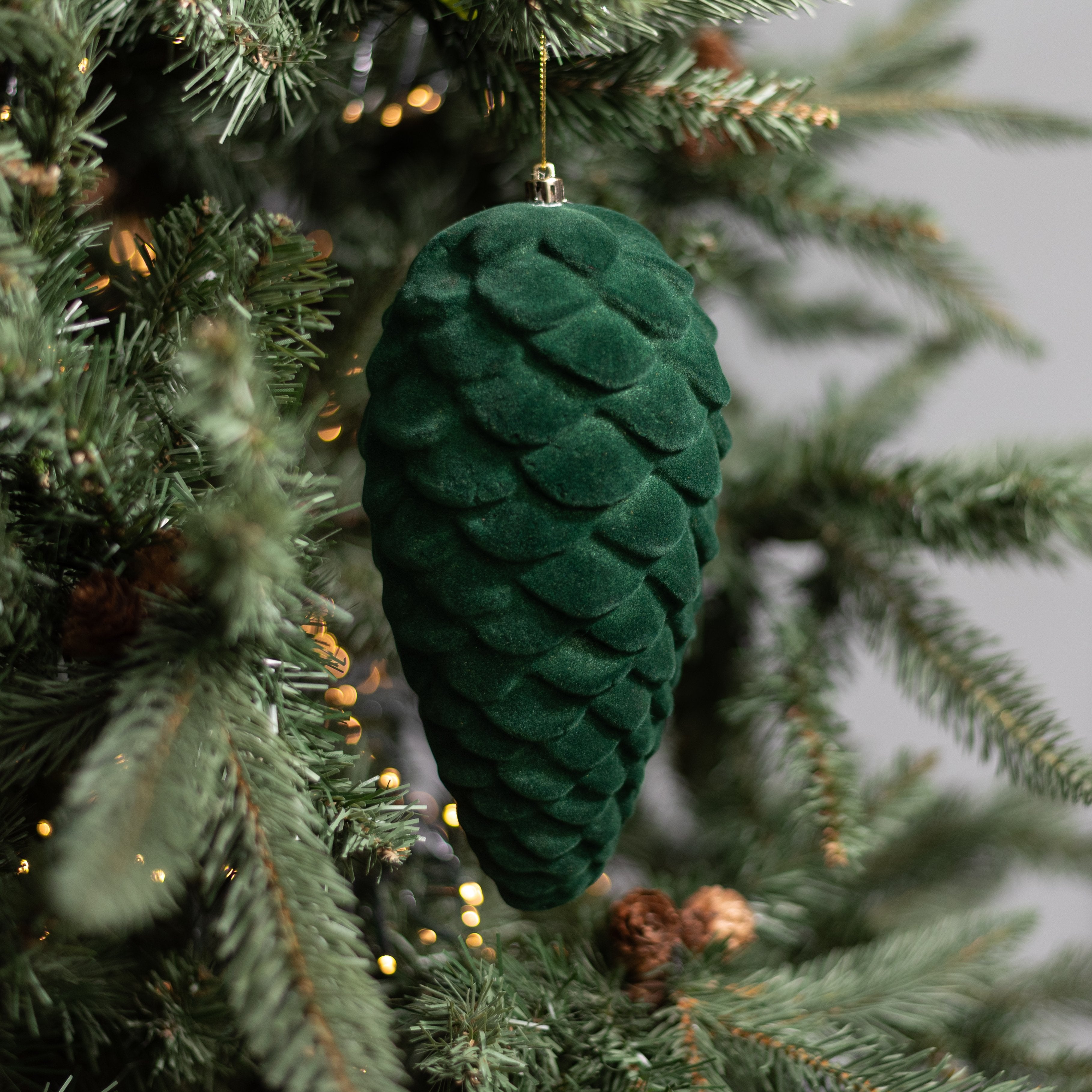 9" Flocked Pinecone Ornament: Dark Green Lifestyle Photo