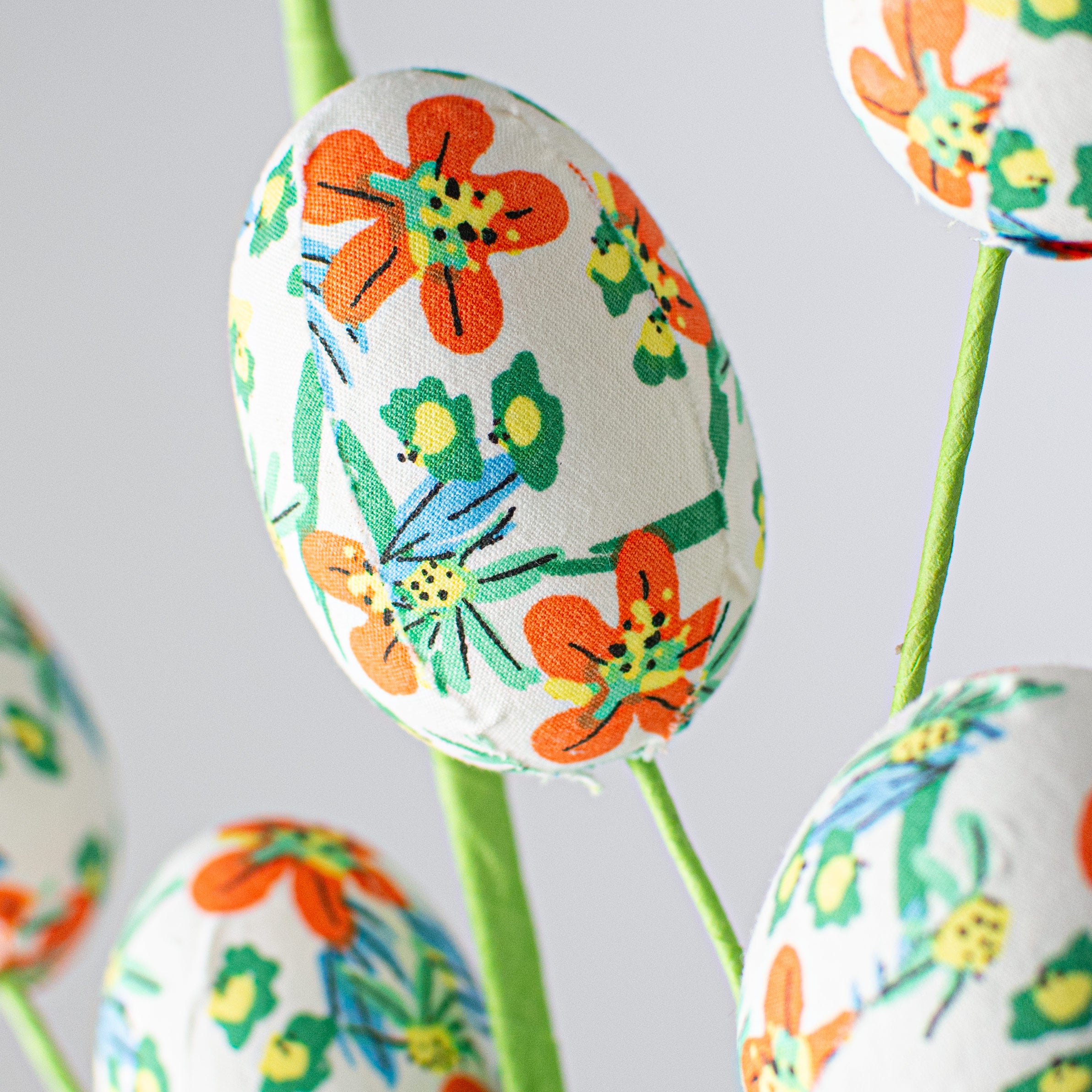 29" Floral Print Easter Egg Spray: Orange, Green, Blue Lifestyle Photo