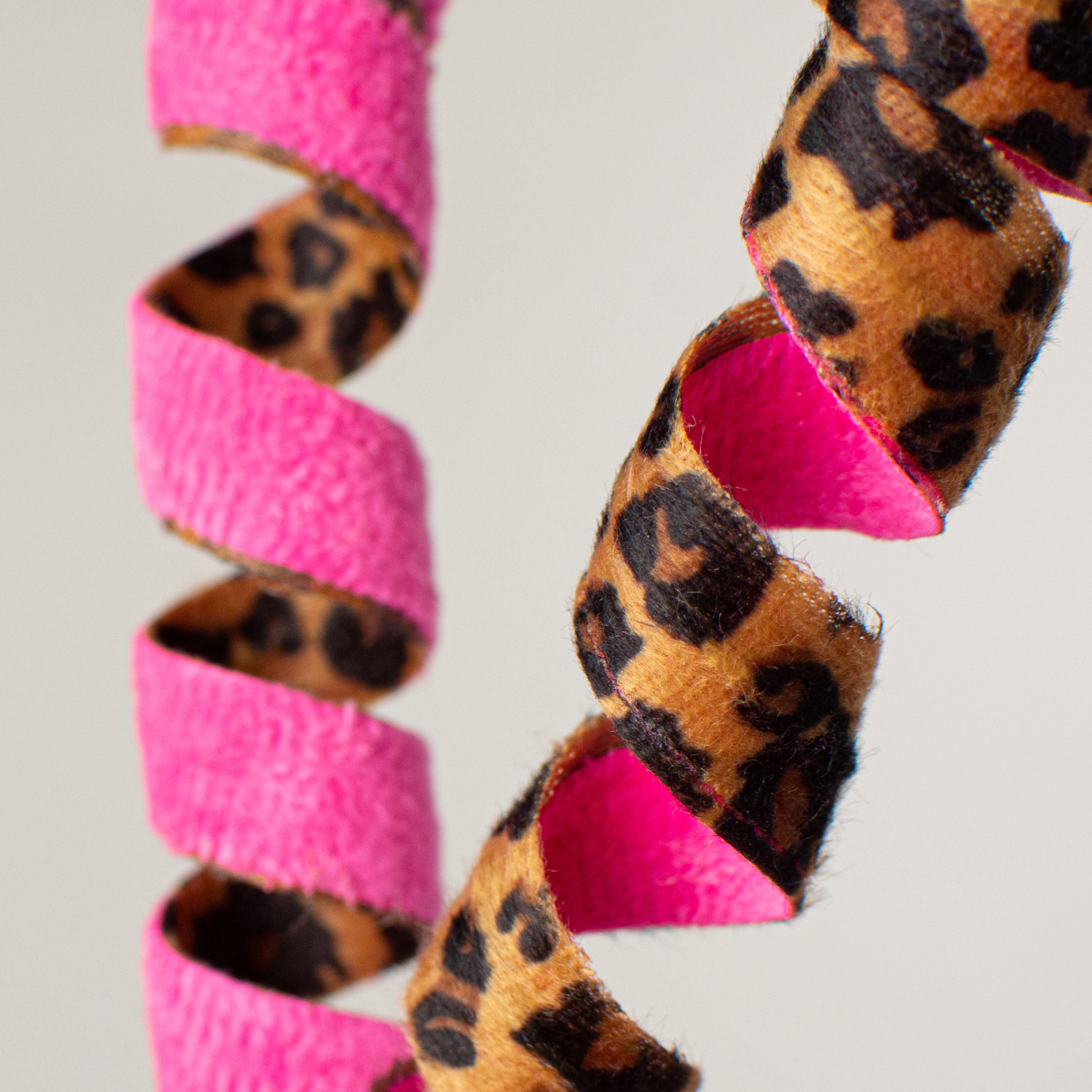 16" Double Sided Frizzy Curly Pick: Cheetah & Fuchsia Lifestyle Photo