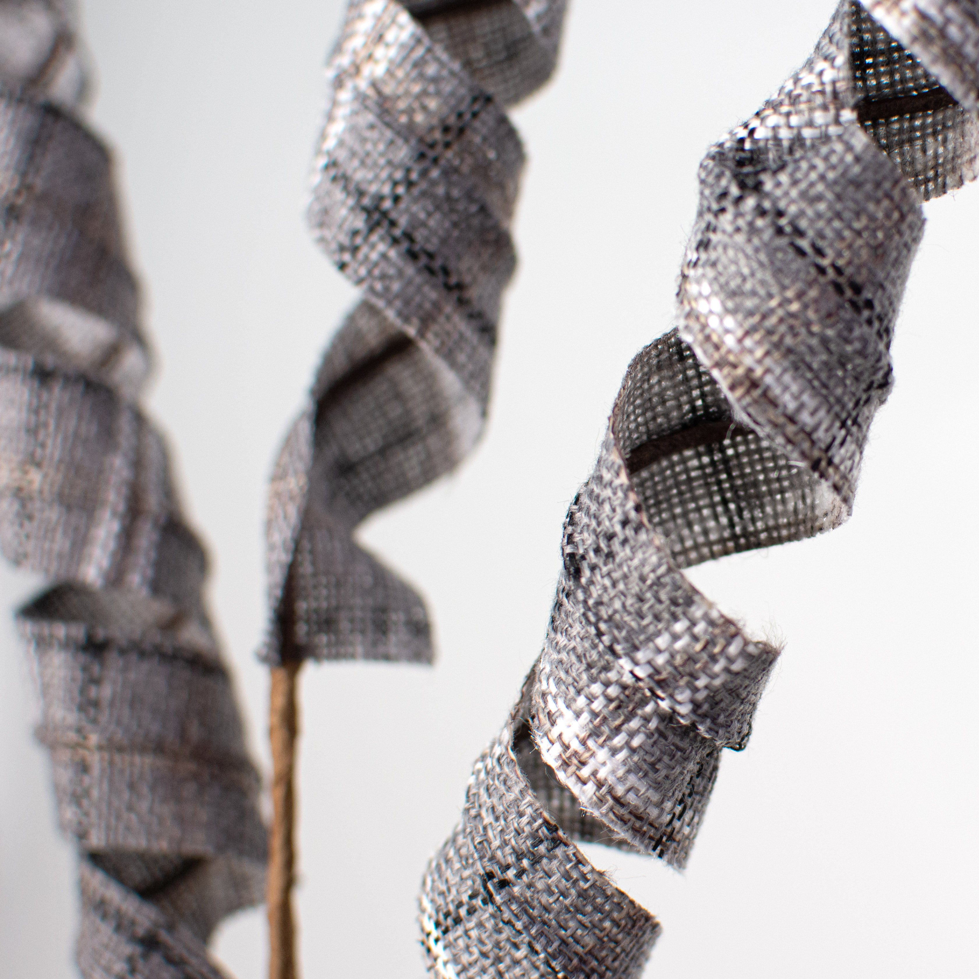 27" Frizzy Curly Spray: Grey, Brown, Black, White Plaid Lifestyle Photo