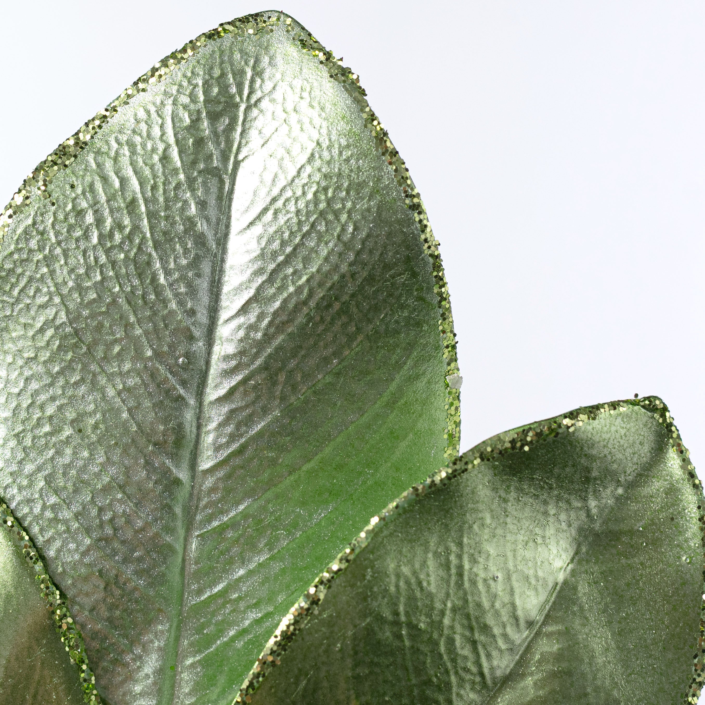 24" Metallic Magnolia Leaves Spray: Light Green