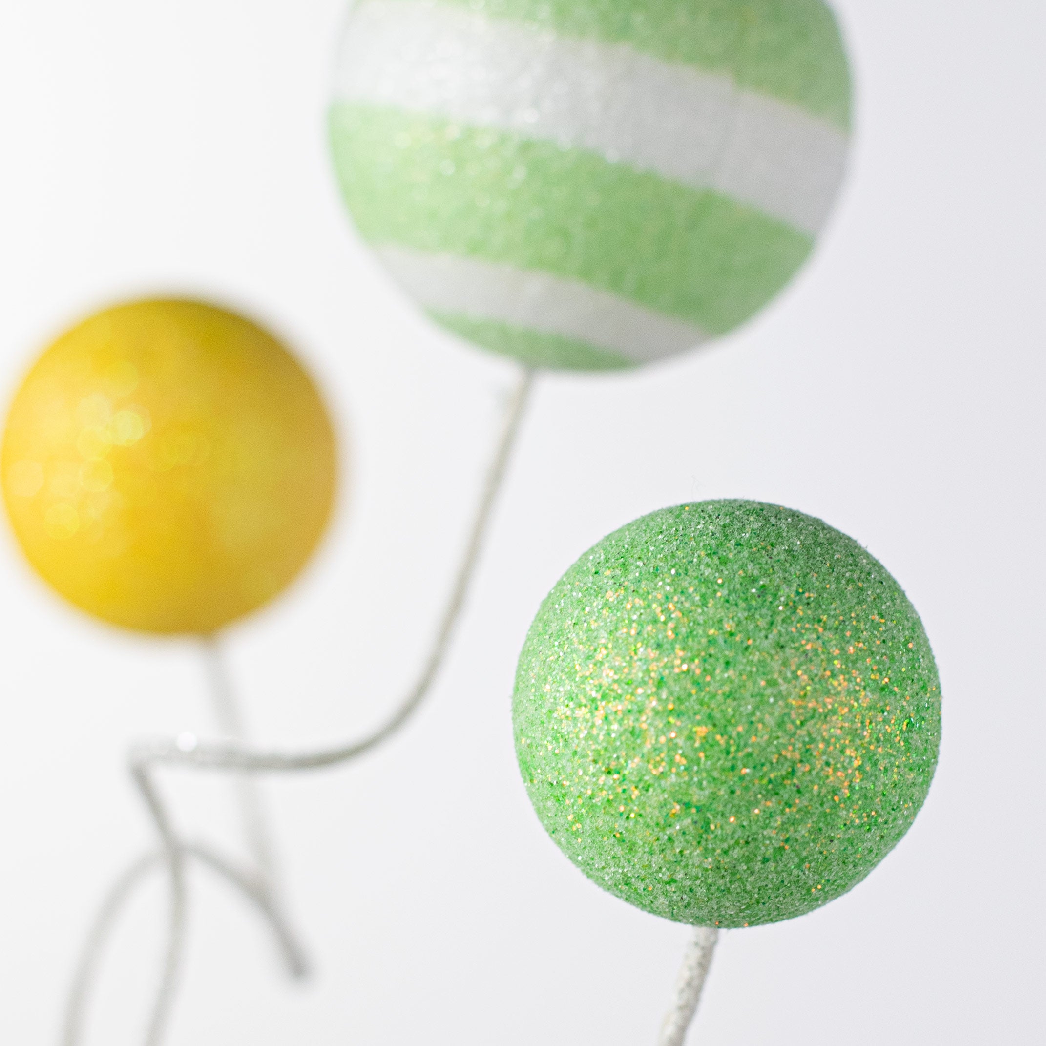 18" Glitter Ball Spray: Light Green & Yellow Lifestyle Photo