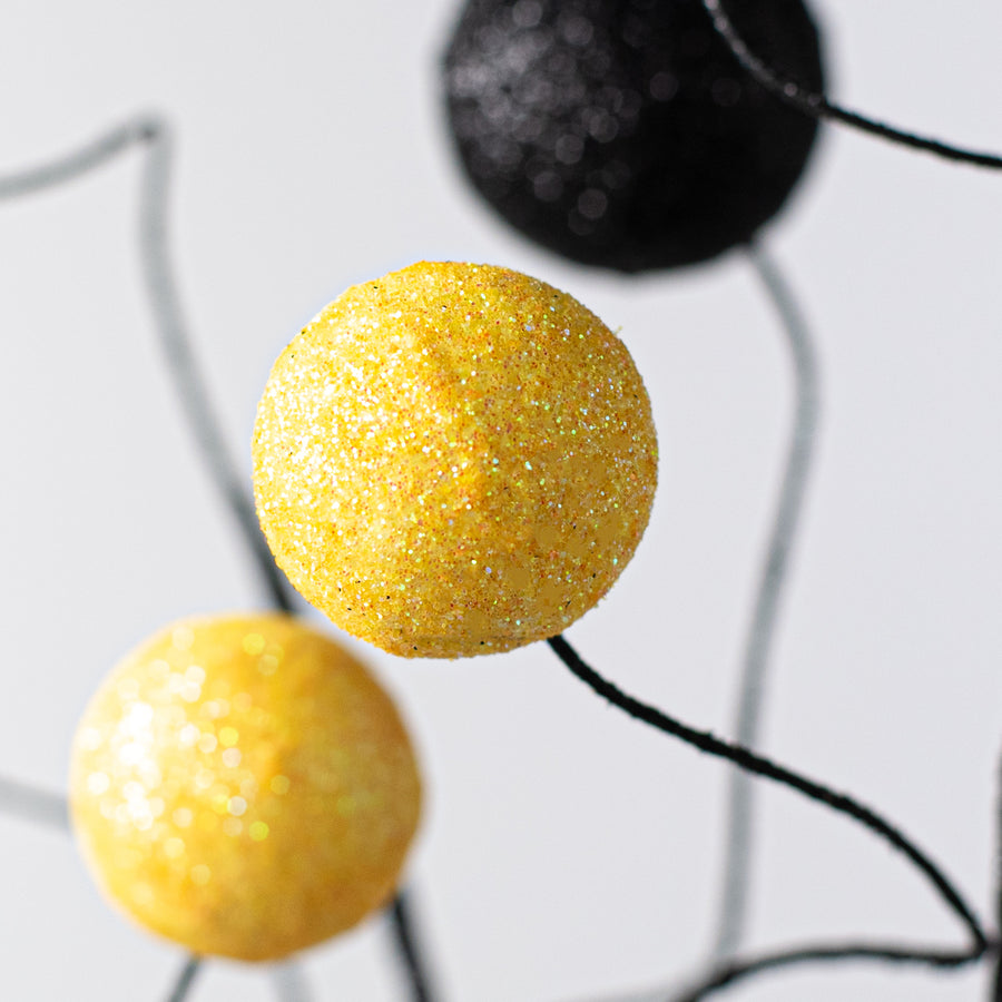 24" Glitter Ball Spray: Yellow & Black Lifestyle Photo