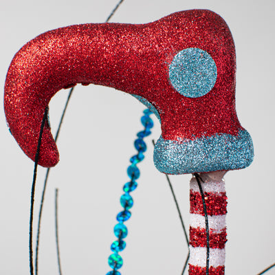 36" Glitter Elf Leg Spray: Red, Black, Turquoise Lifestyle Photo