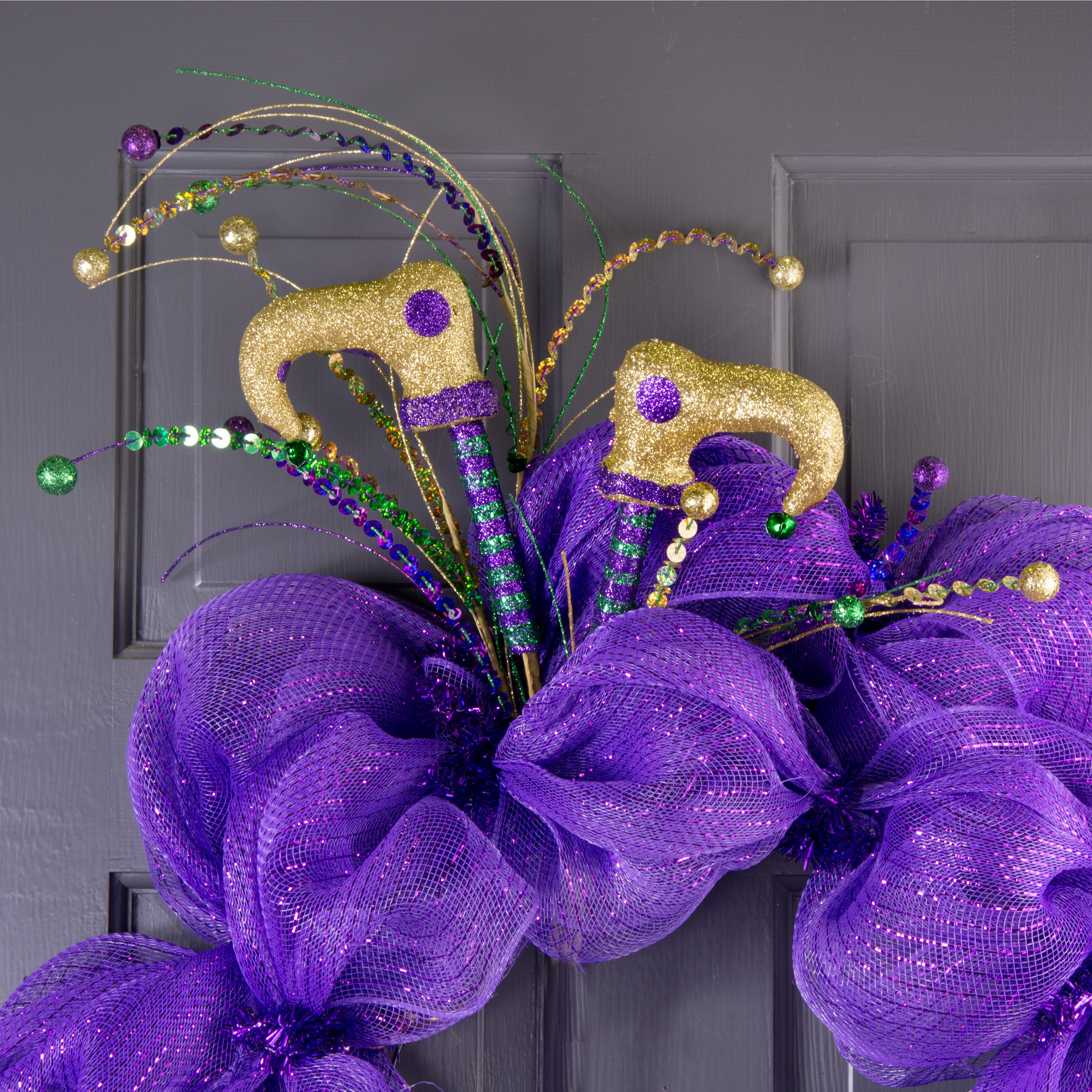 36" Glitter Mardi Gras Jester Leg Spray: Green, Purple, Gold Lifestyle Photo