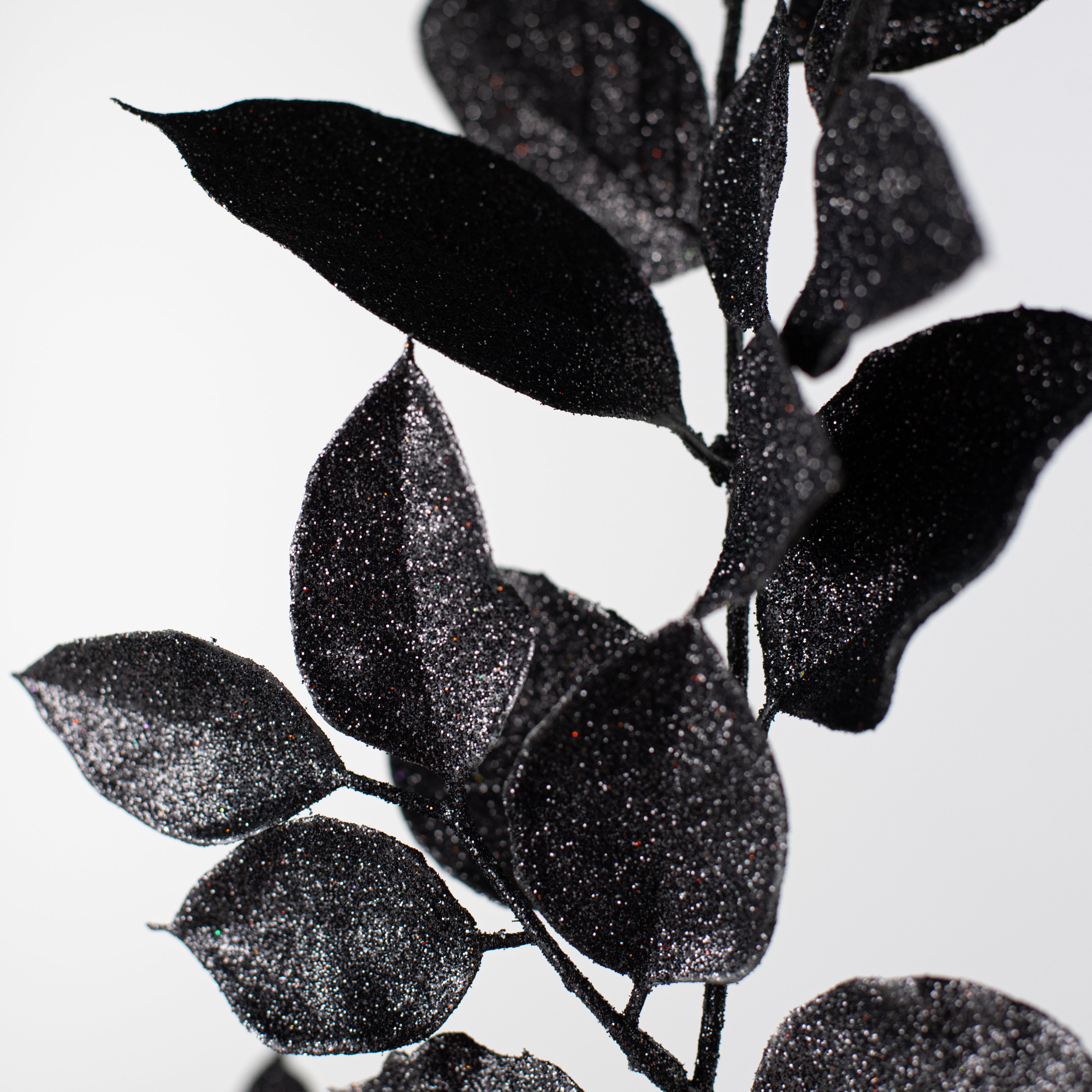 25" Glitter Salal Leaf Spray: Black Lifestyle Photo