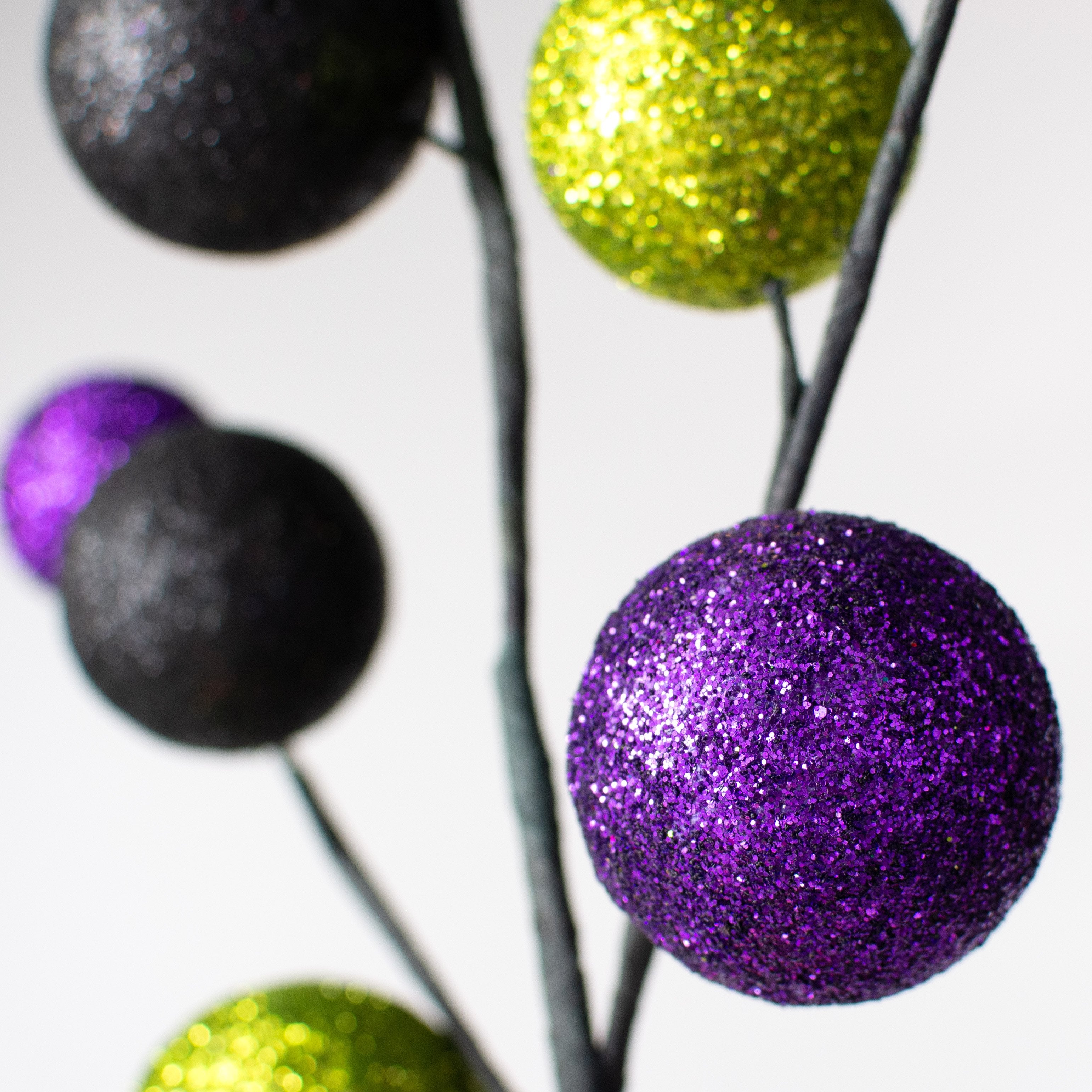 21" Glittered Ball Spray: Lime Green, Purple & Black Lifestyle Photo