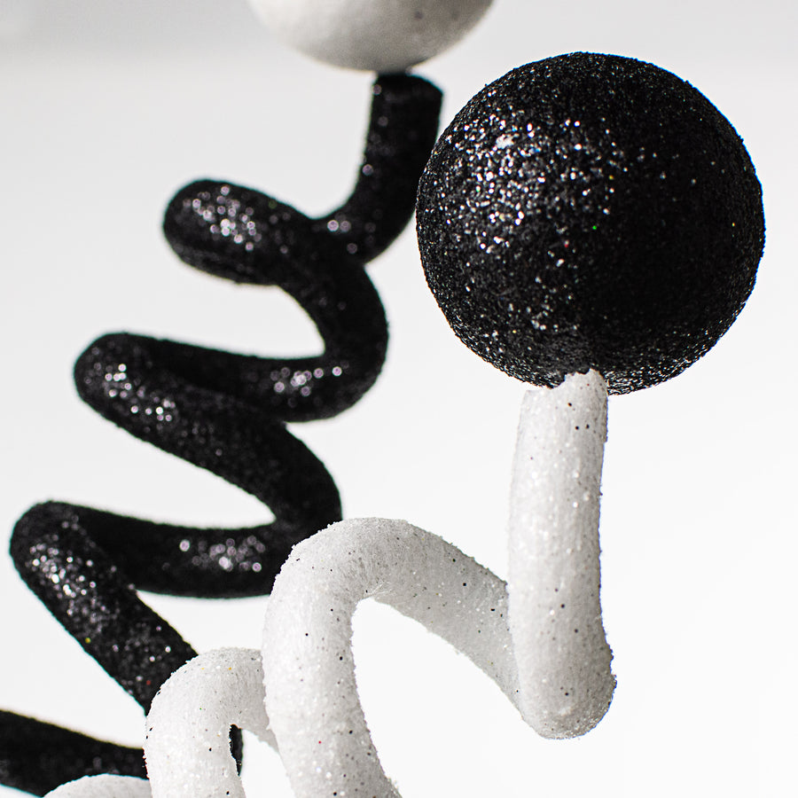 31" Glittered Ball Tubing Spring Spray: Black & White Lifestyle Photo