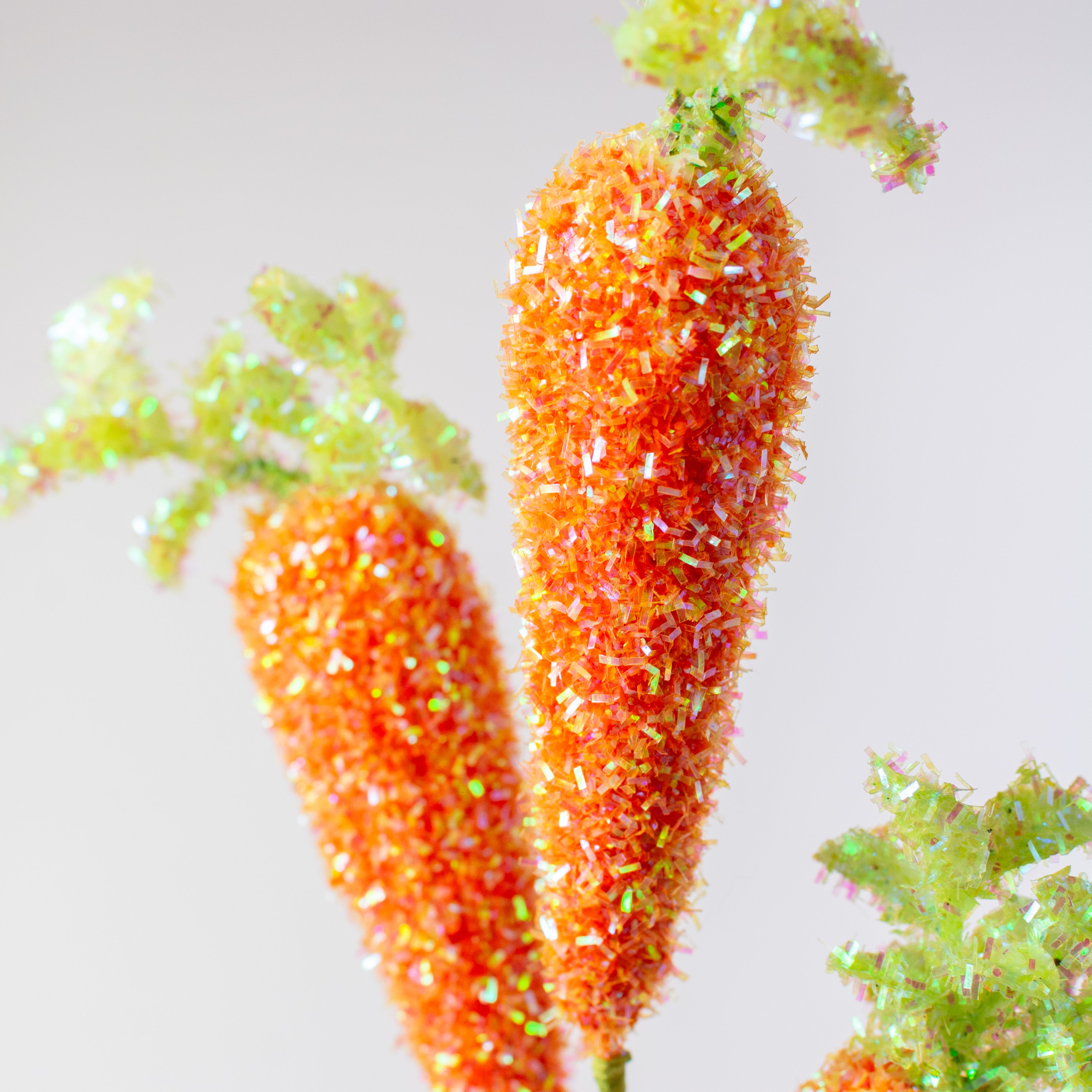 27" V-Cut Foil Carrots Spray: Iridescent Orange