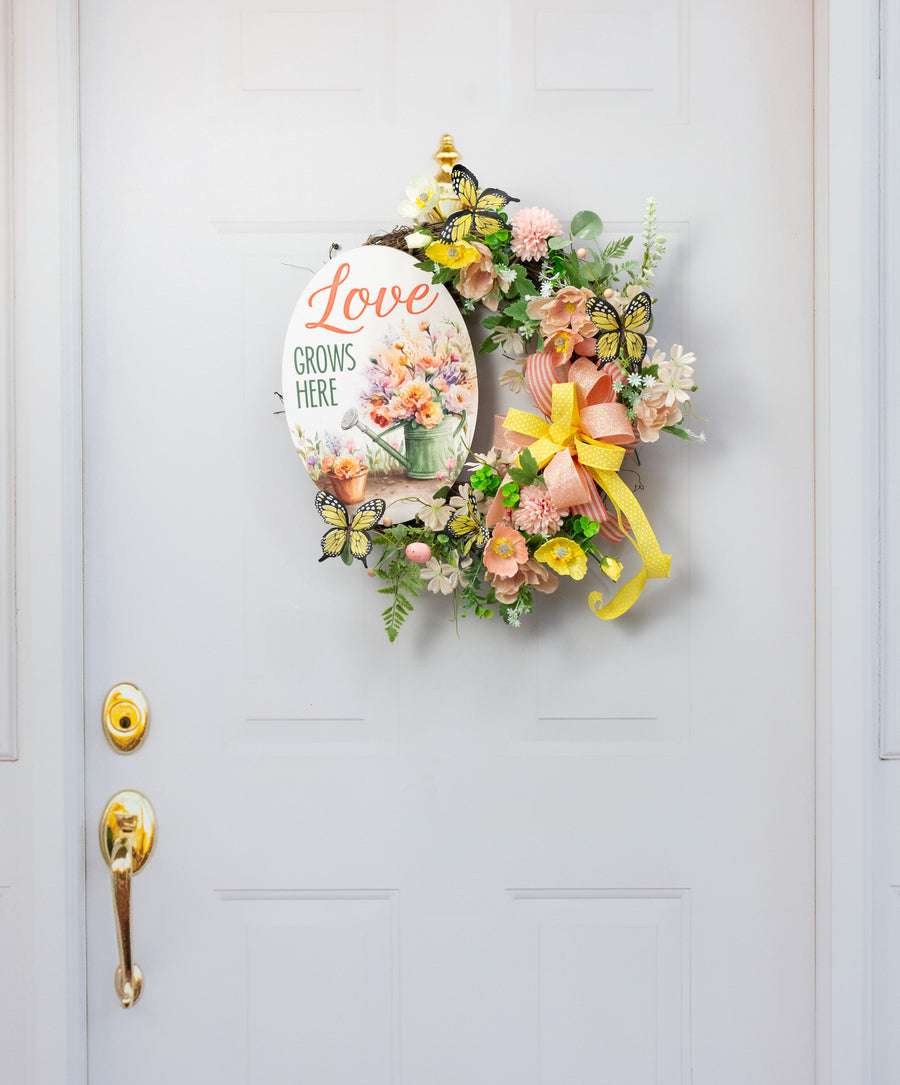 13" Oval Wooden Sign: Love Grows Here Flowers