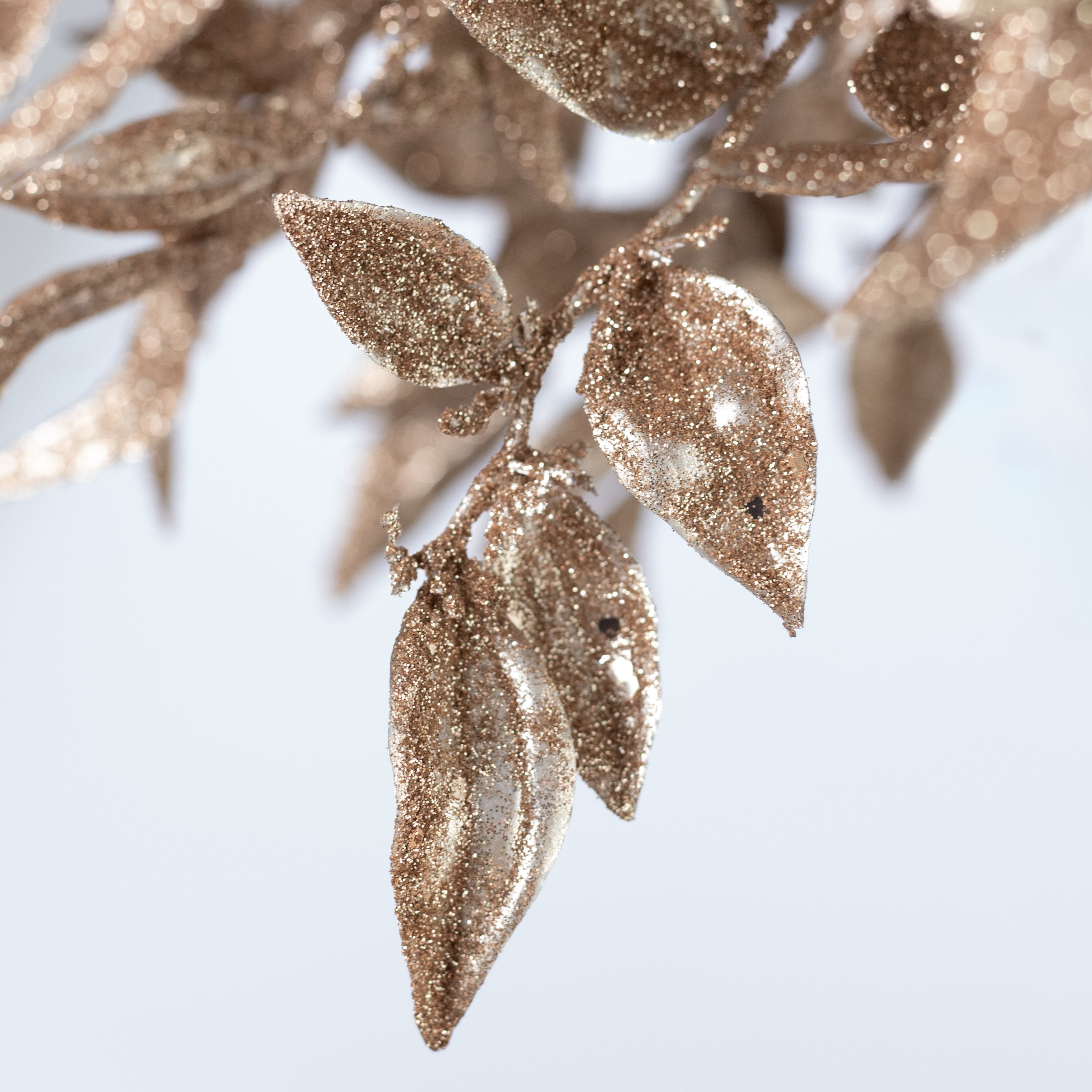 [IMPERFECT] 17" Glittered Plastic Leaf Bush: Champagne Gold Lifestyle Photo