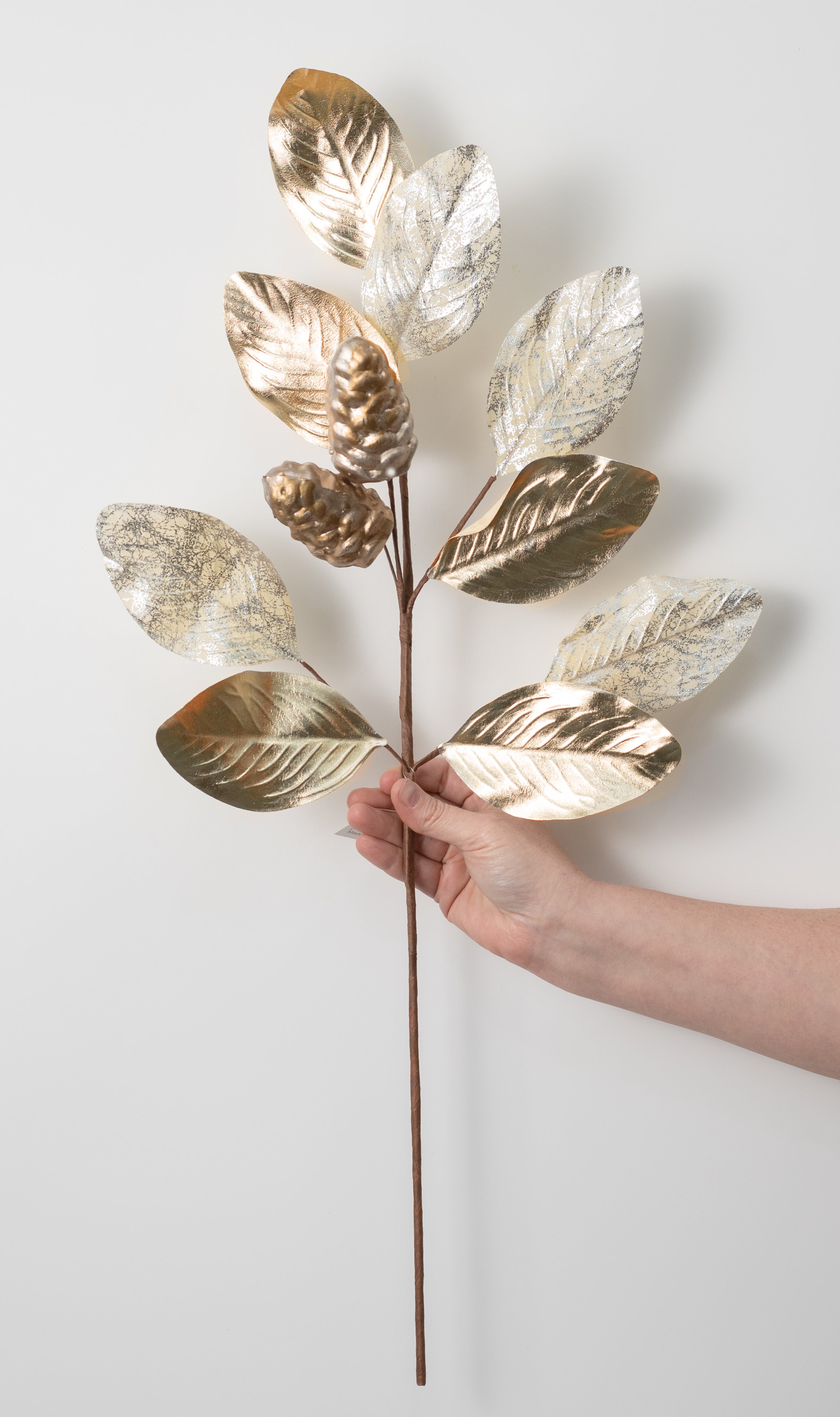 29" Metallic Magnolia Leaves & Pinecones Spray: Champagne