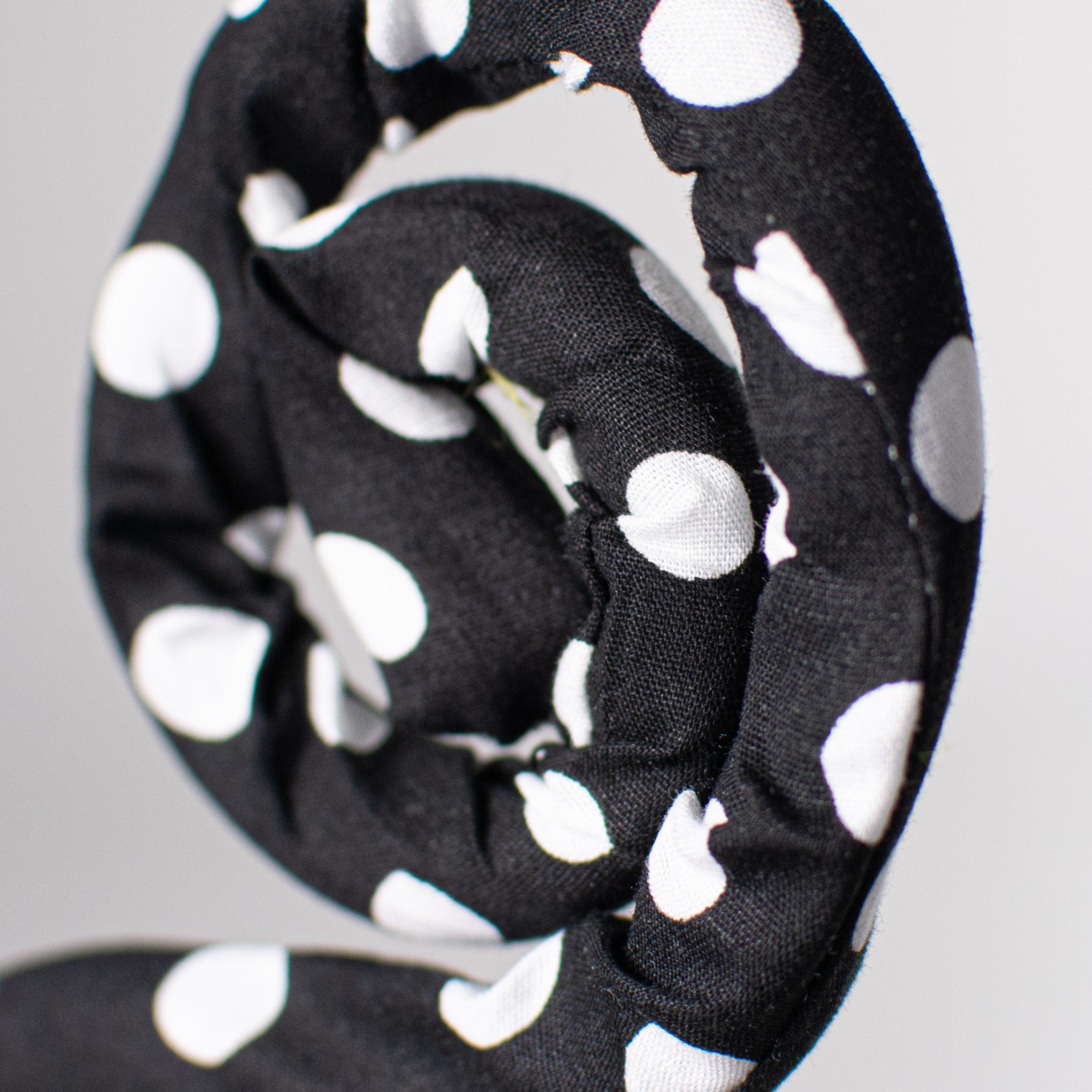 30" Knit Fabric Polkadot Spiral Curly Spray: Black & White Lifestyle Photo
