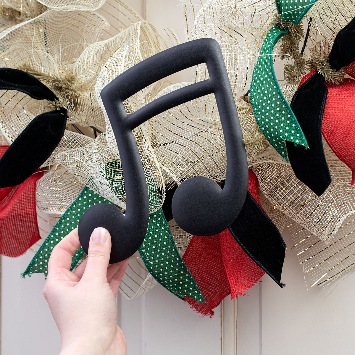 7" Metal Embossed Hanger: Black Double Music Note Lifestyle Photo