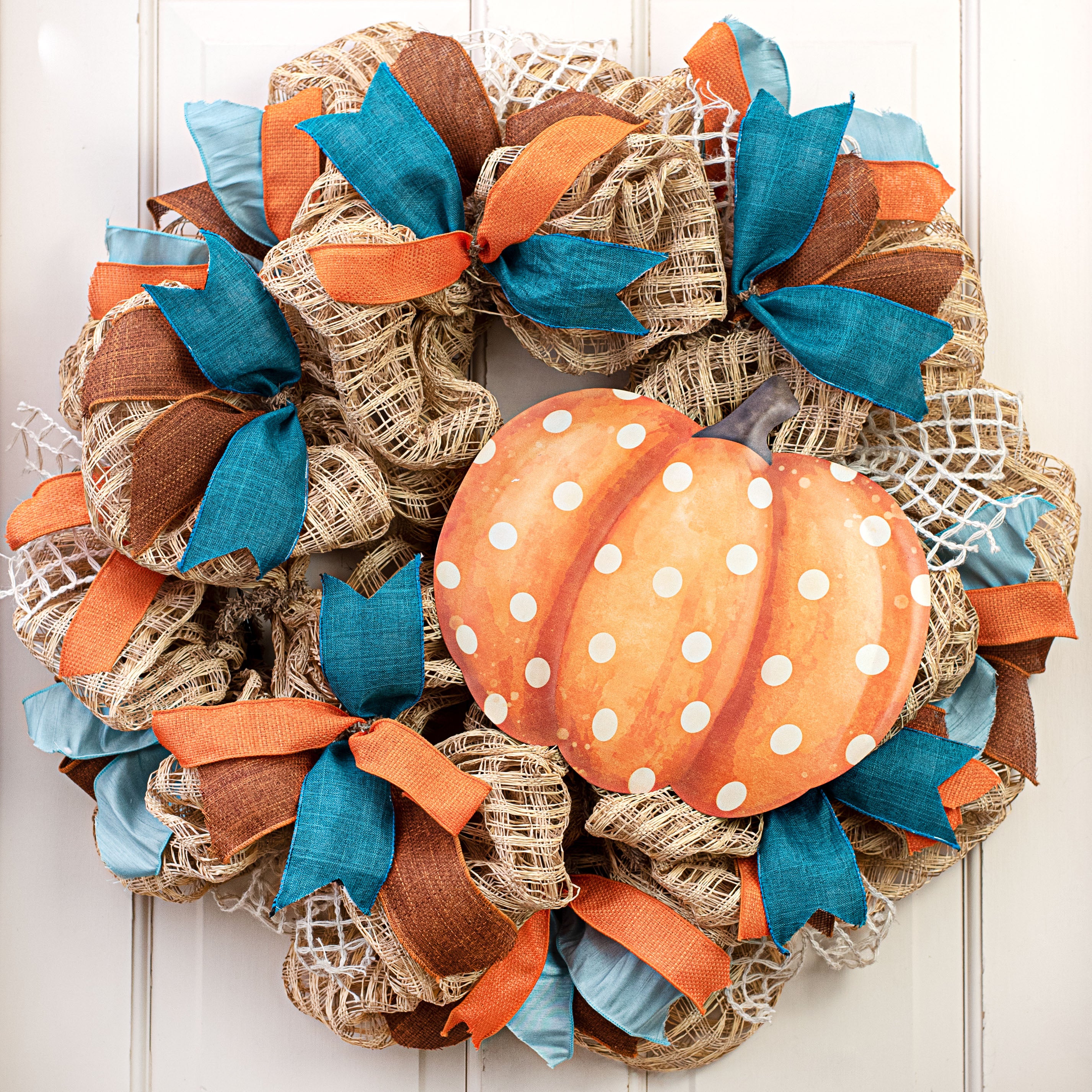 12" Metal Embossed Hanger: Orange & Cream Polka Dot Pumpkin Lifestyle Photo