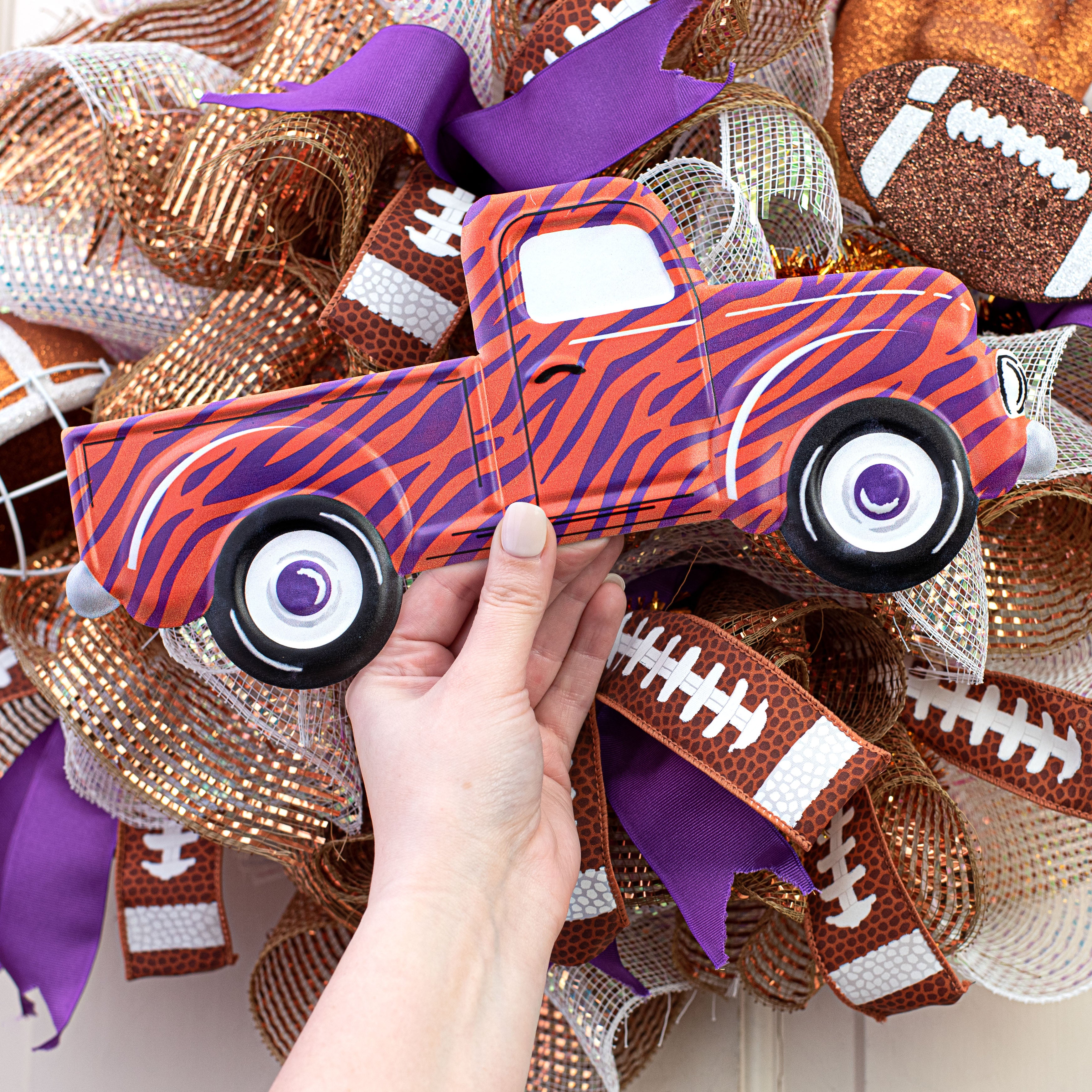 12" Metal Embossed Hanger: Orange & Purple Animal Stripe Truck Lifestyle Photo