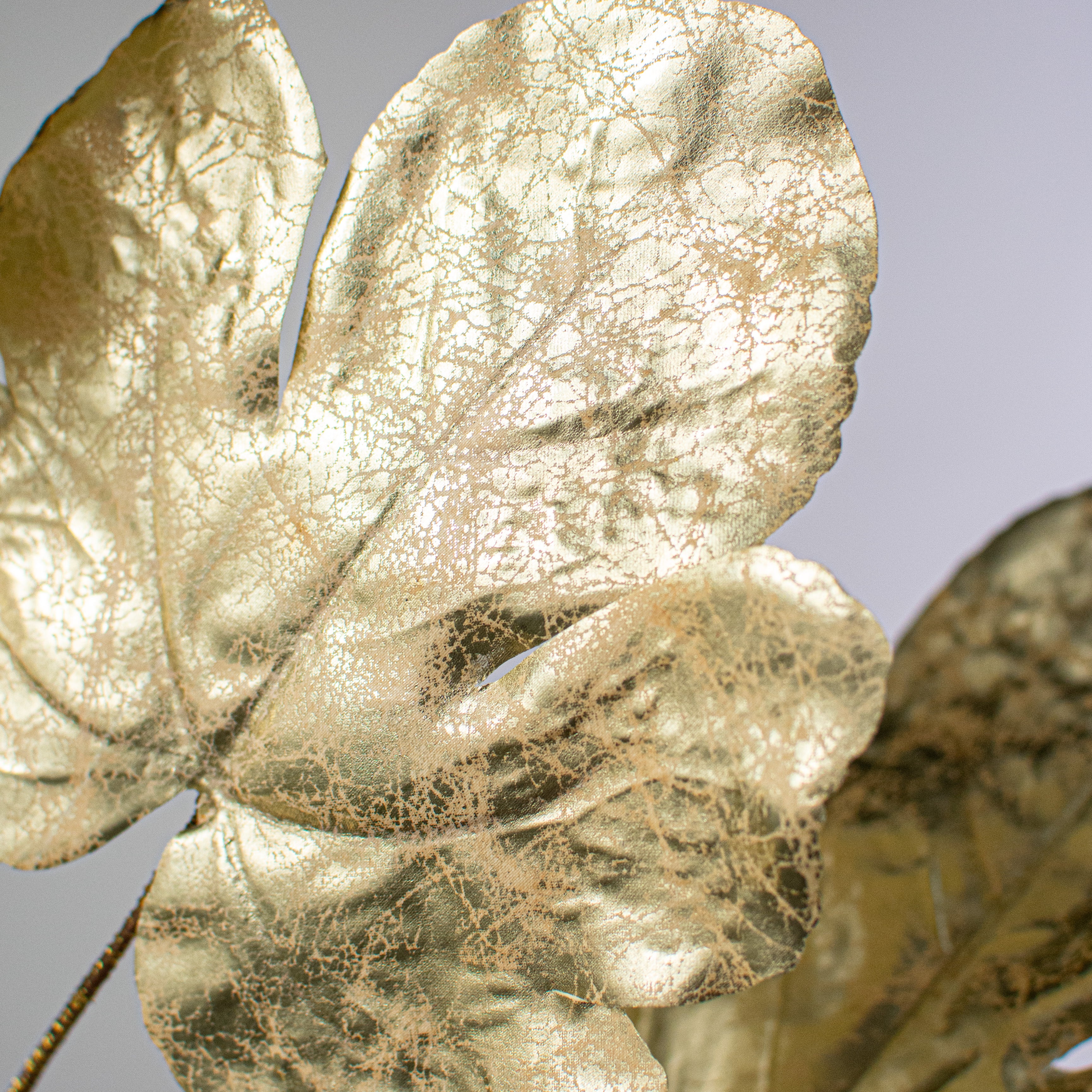 27" Metallic Fig Leaf Spray: Champagne Lifestyle Photo