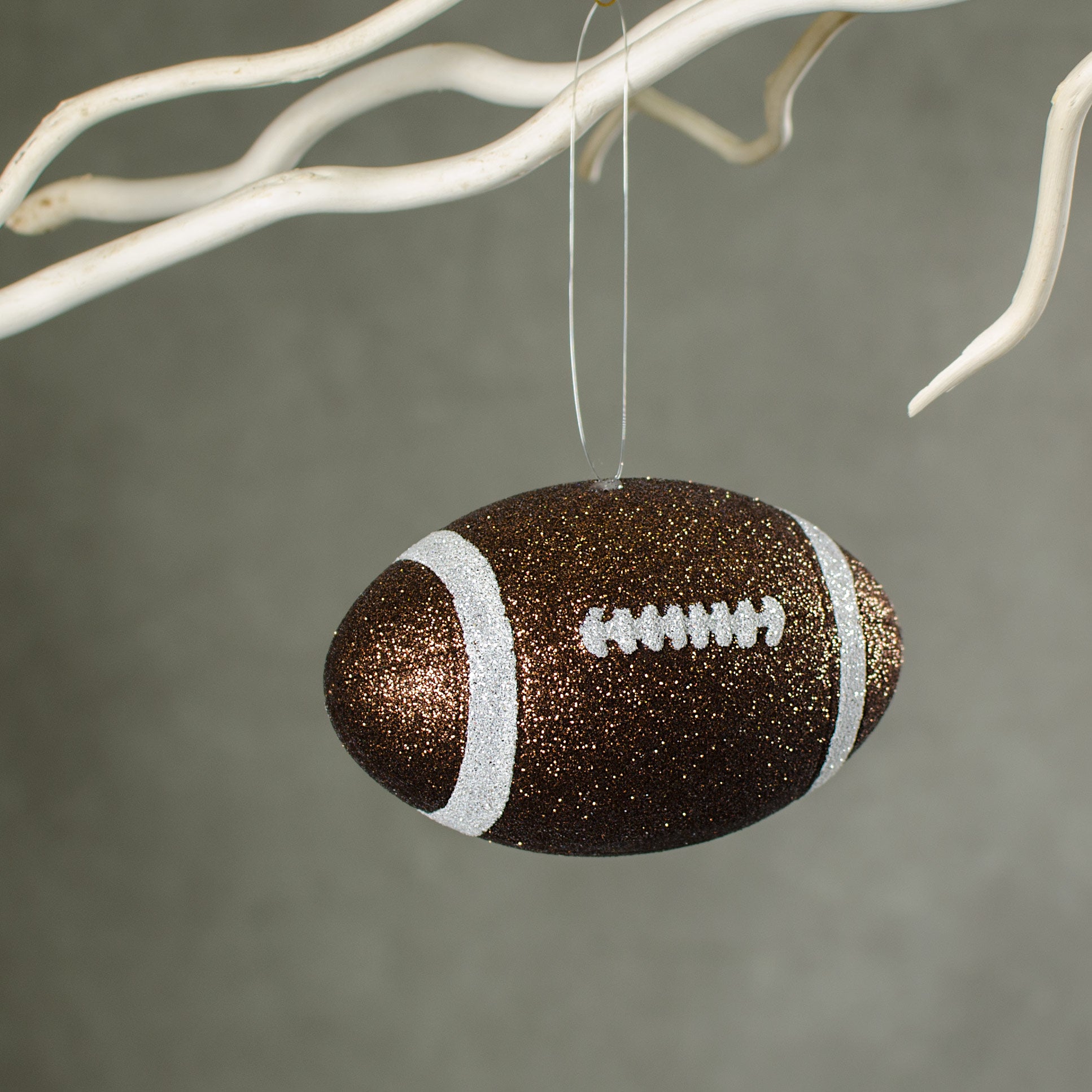 4.5" Metallic Glitter Football Ornament: Brown & White Lifestyle Photo