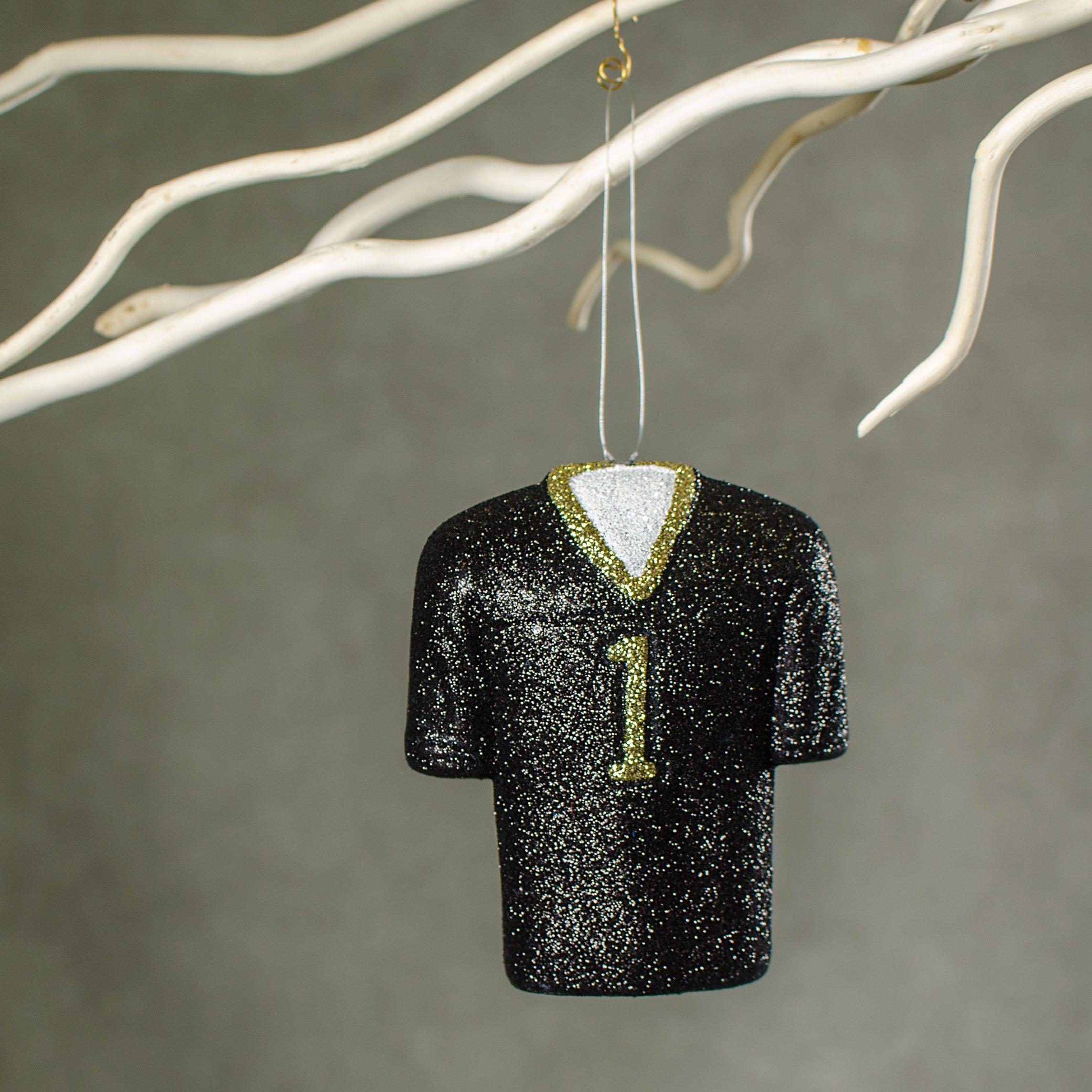 4.5" Metallic Glittered Football Jersey Ornament: Black & Gold Lifestyle Photo