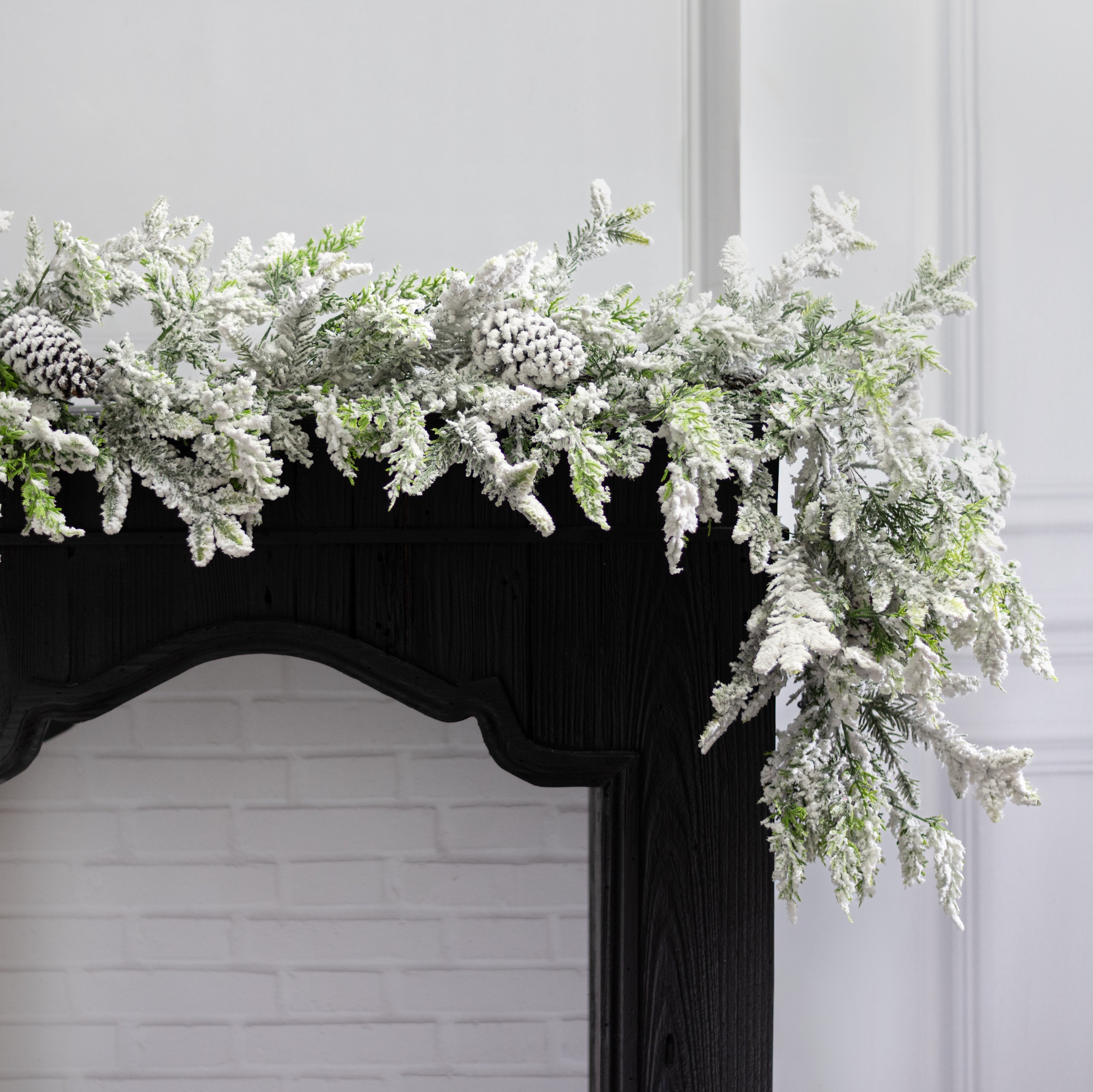 6' Mixed Pine, Pinecone & Cedar Garland: Flocked Lifestyle Photo