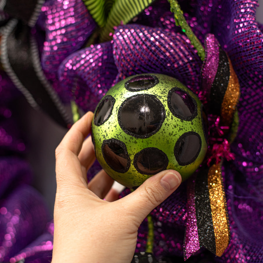 100mm Antiqued Dots Ornament: Lime Green & Black Lifestyle Photo