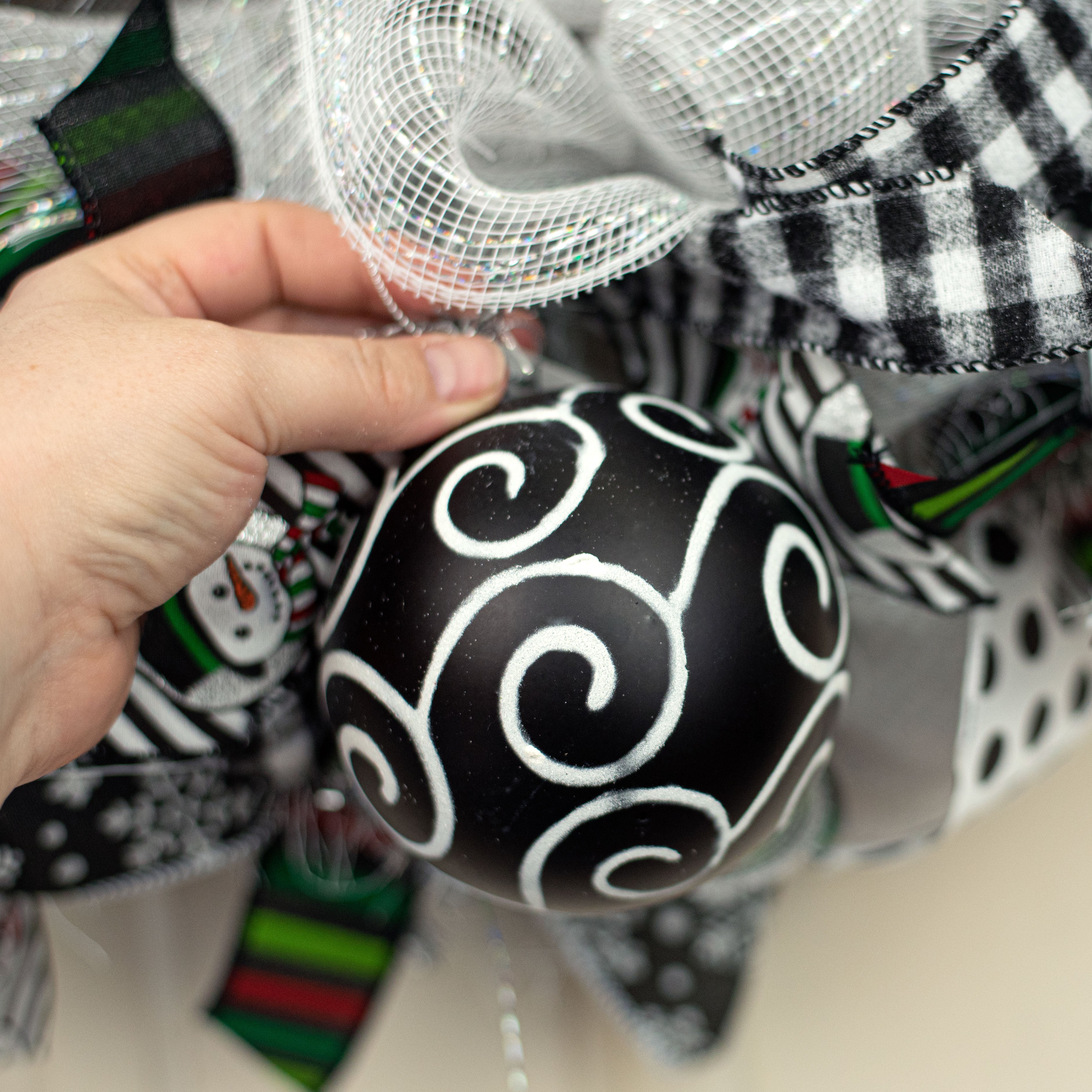 100MM Glitter Scroll Swirl Ball: Matte Black & White Lifestyle Photo