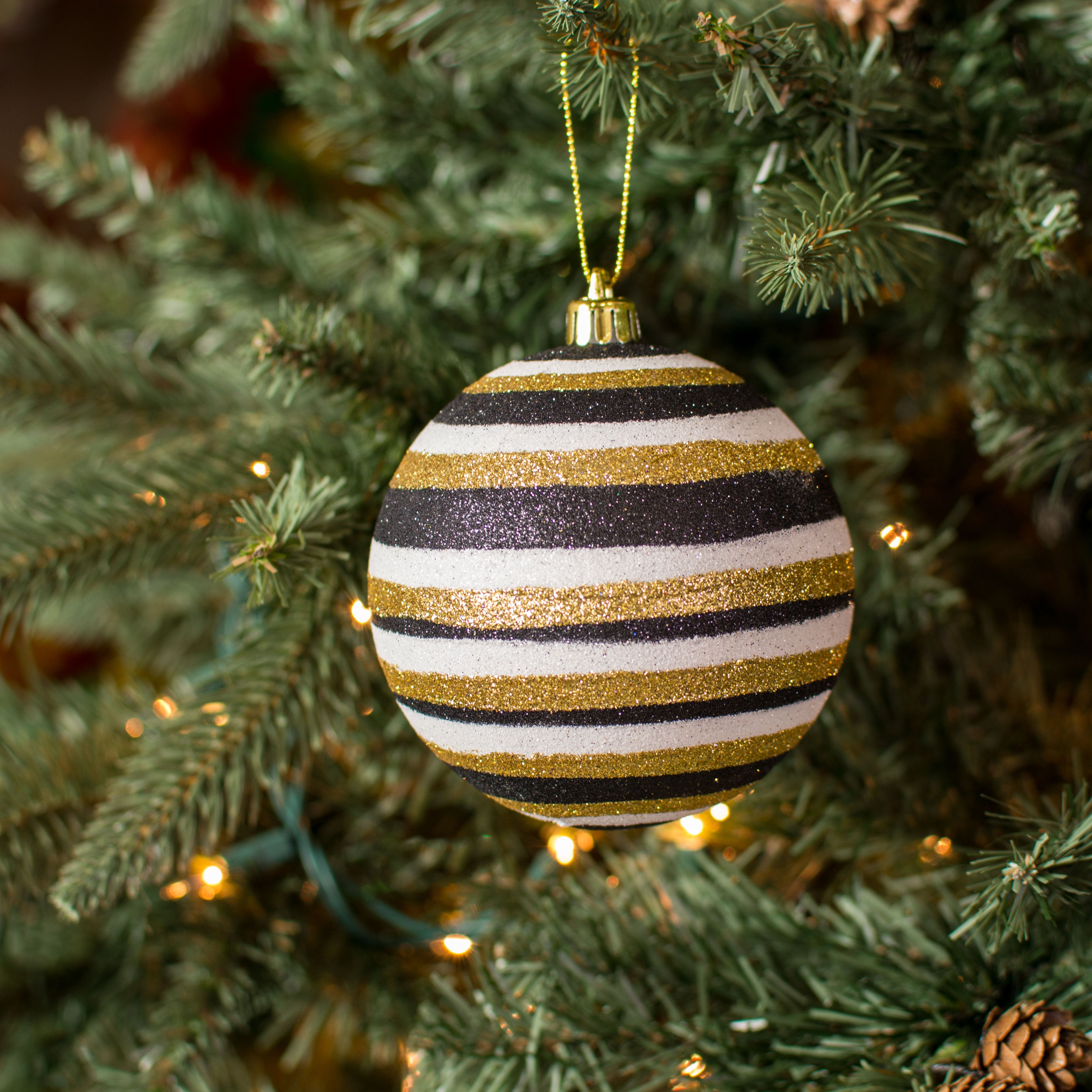 100MM Horizontal Stripe Glitter Ball Ornament: Black, Gold, White Lifestyle Photo