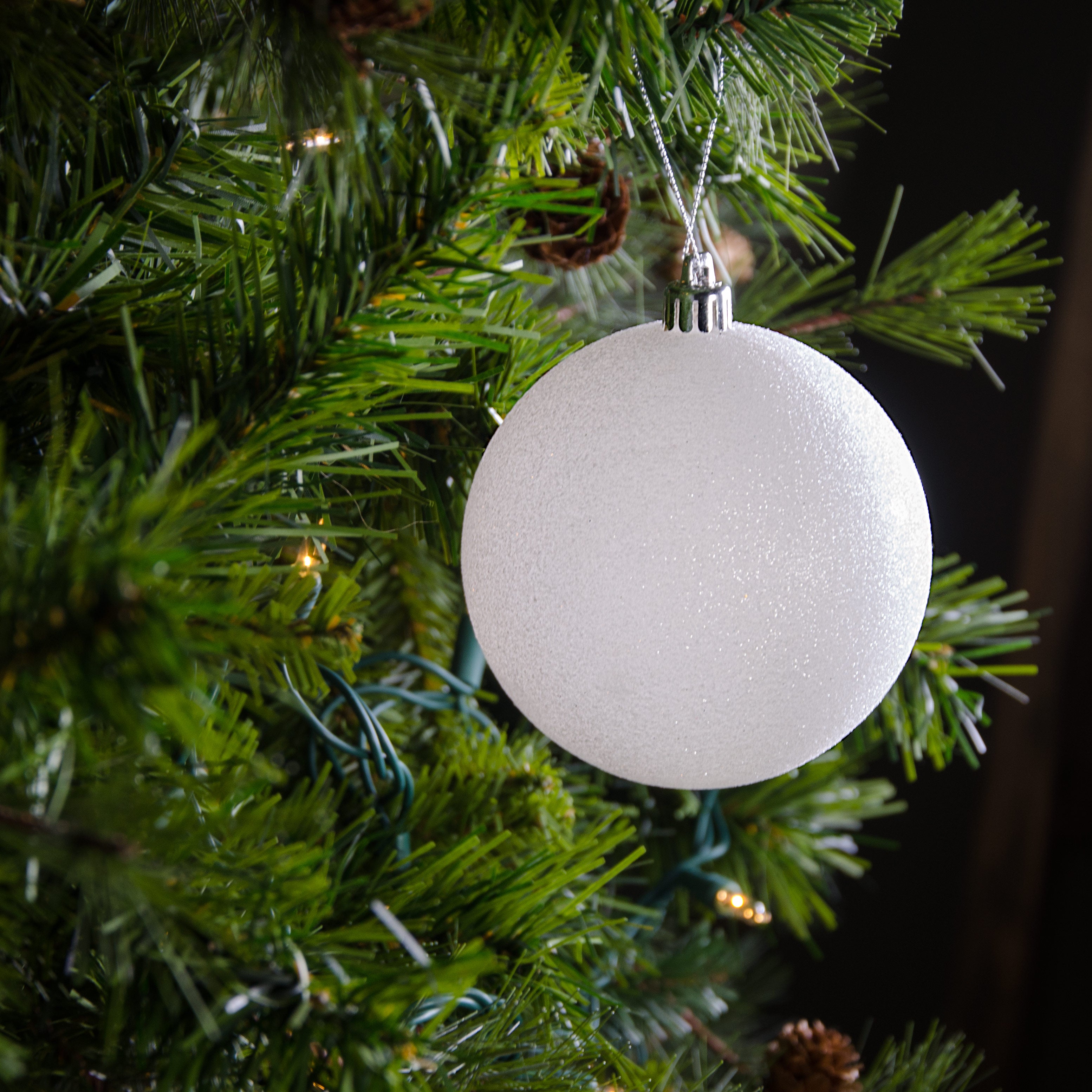 100MM Round Glitter Ball Ornament: Metallic White Lifestyle Photo