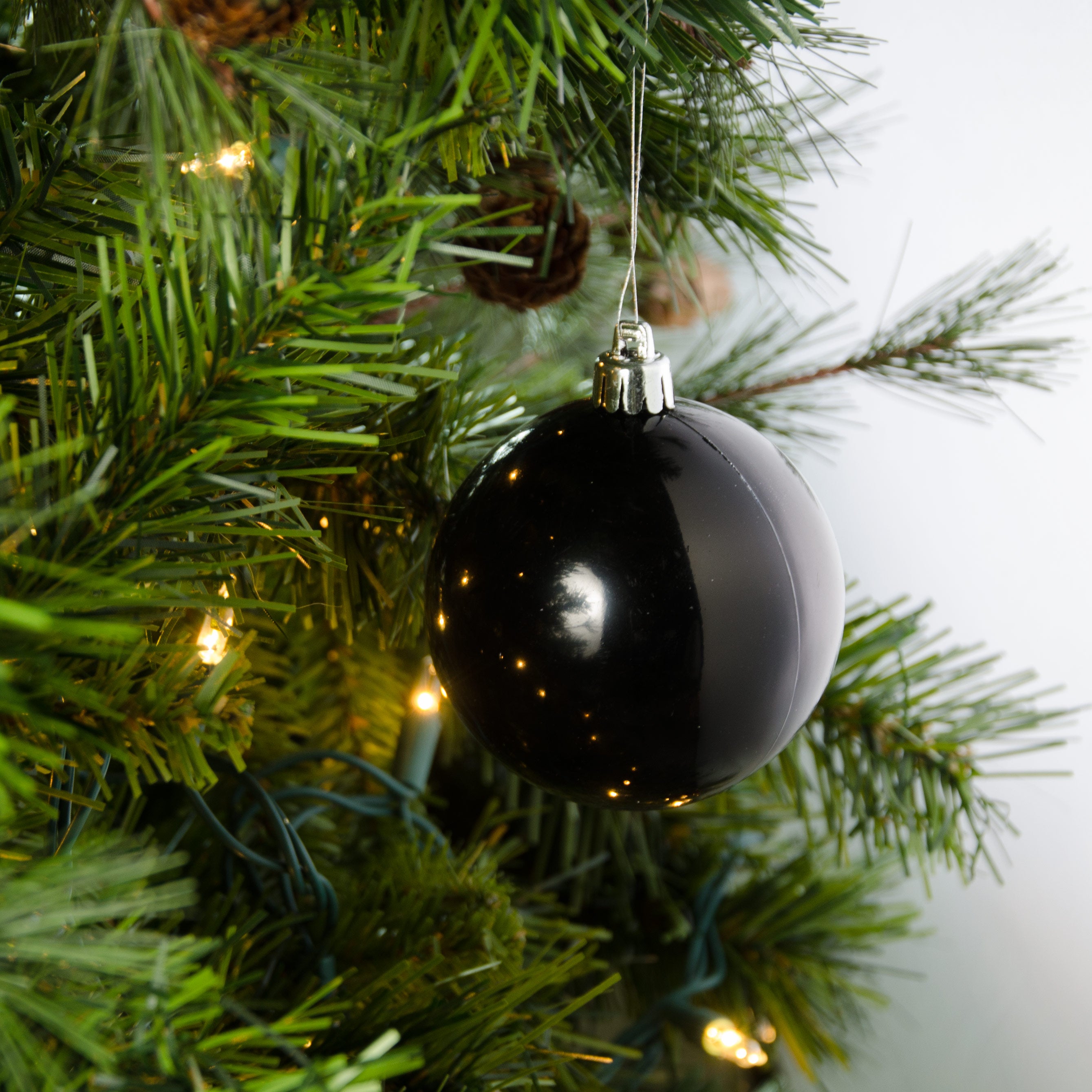80MM Round Smooth Metallic Ball Ornament: Shiny Black Lifestyle Photo