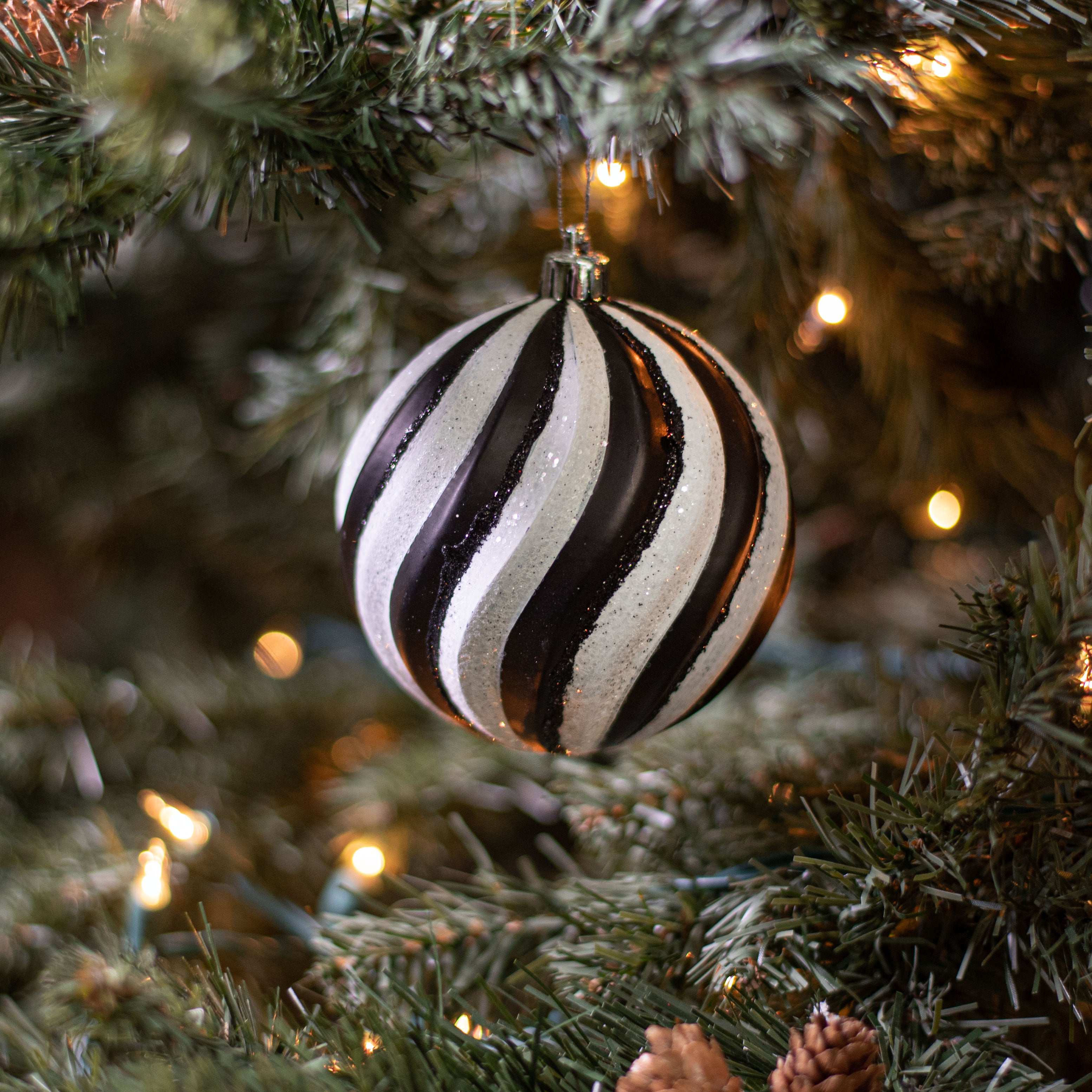 100MM Swirl Ball Ornament: Black & White Lifestyle Photo