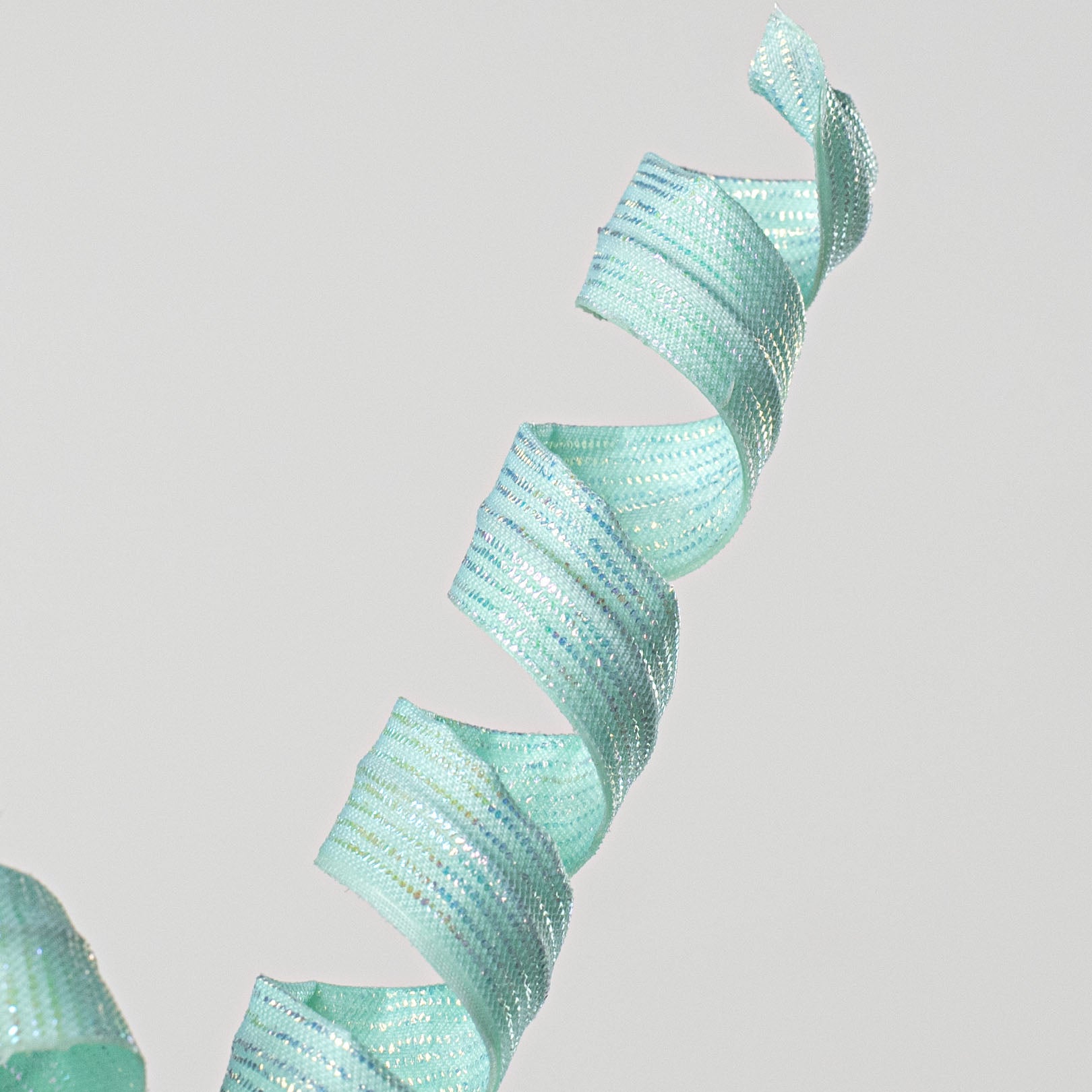 16" Pearlescent Pastel Curly Pick: Iridescent Mint Lifestyle Photo